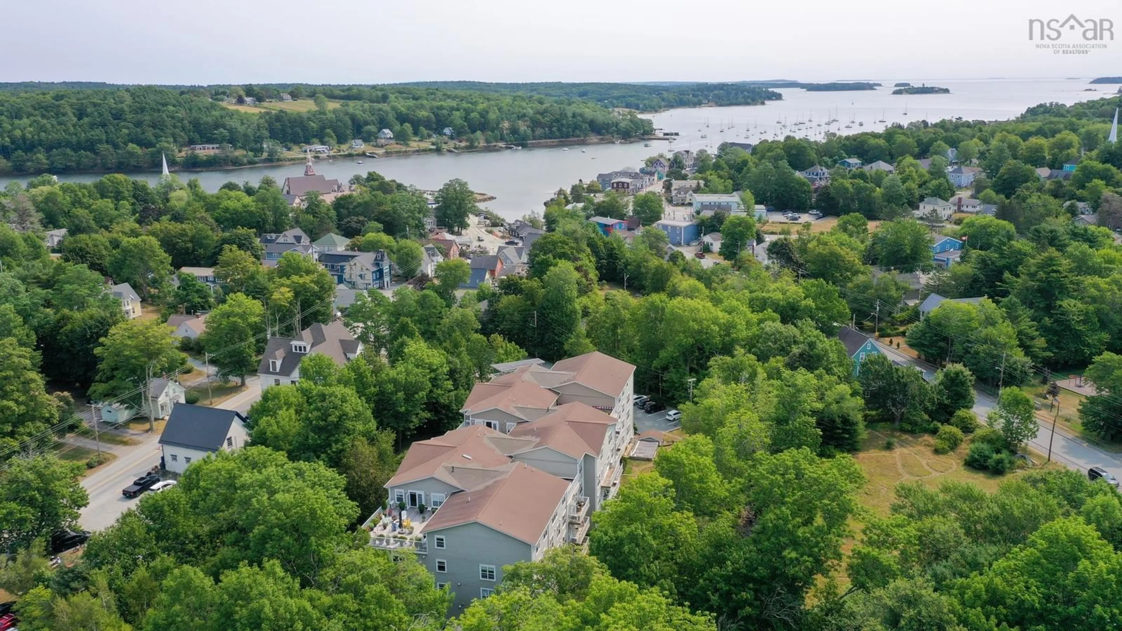 A pic from outside/outdoor area/front of a property/back of a property/a pic from drone, water/lake/river/ocean view for 476 Main St #308, Mahone Bay Nova Scotia B0J 2E0