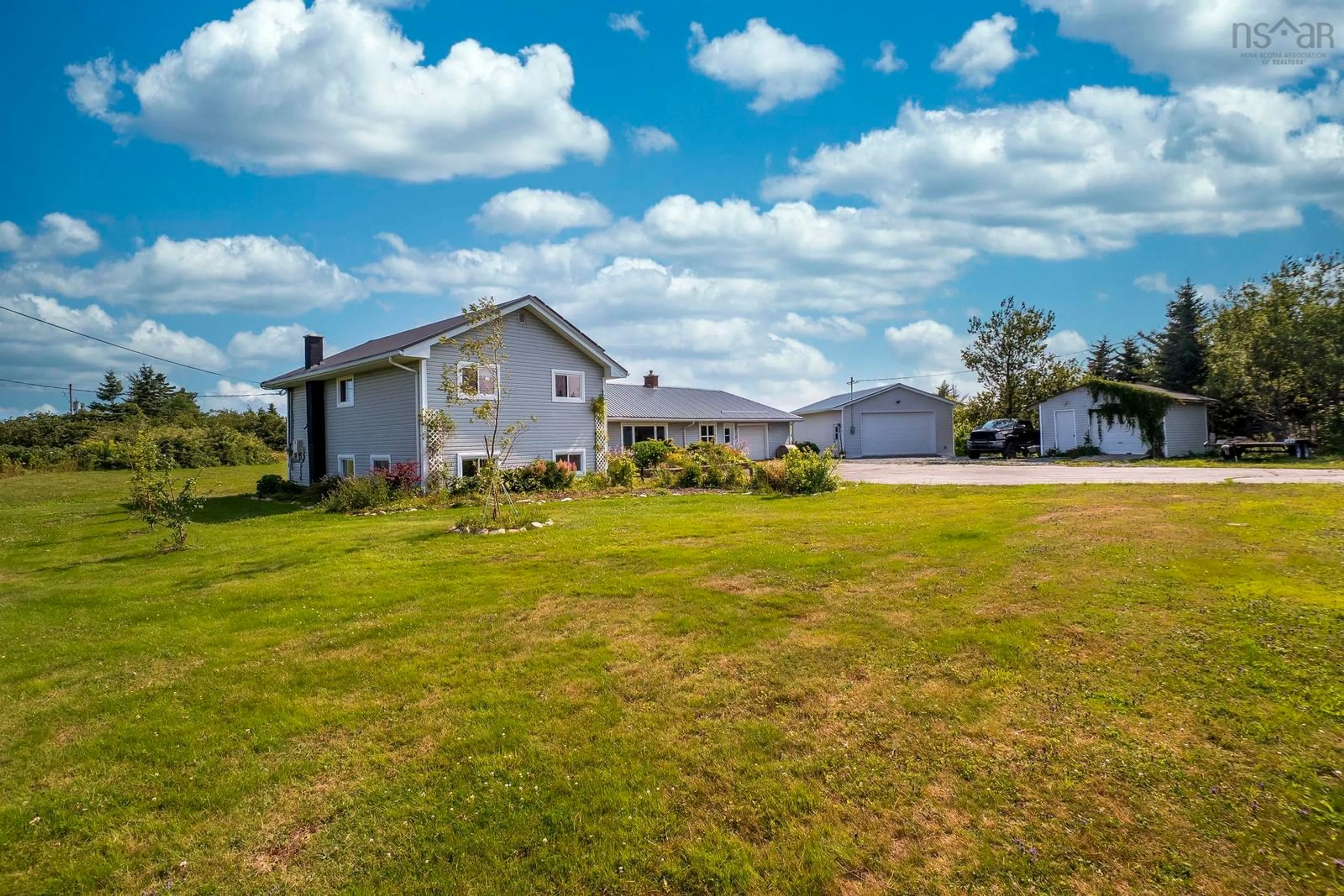 A pic from outside/outdoor area/front of a property/back of a property/a pic from drone, water/lake/river/ocean view for 1870 Crowell Rd, East Lawrencetown Nova Scotia B2Z 1N9