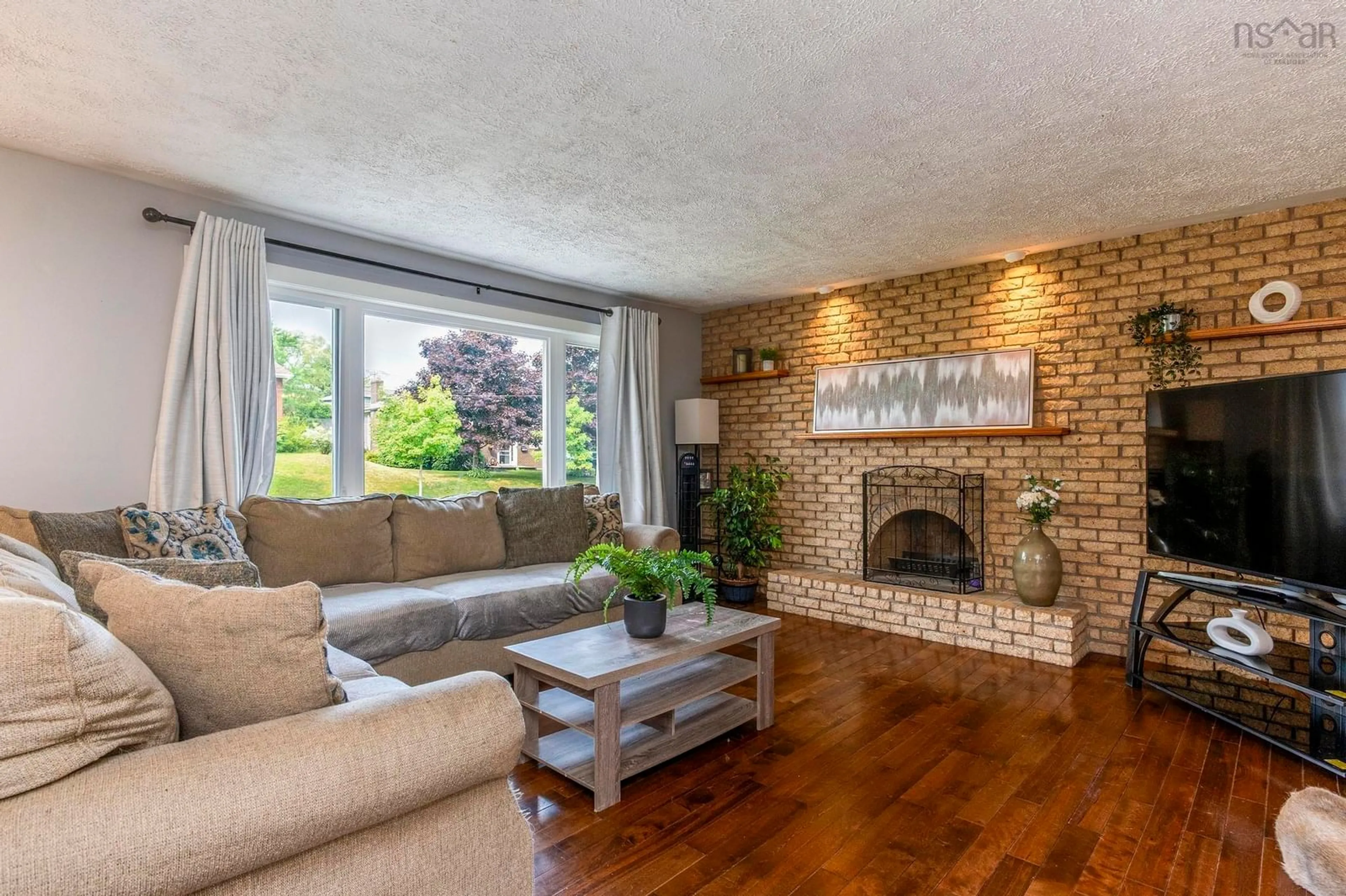 Living room with furniture, wood/laminate floor for 93 Hannebury Dr, Dartmouth Nova Scotia B2V 1P7