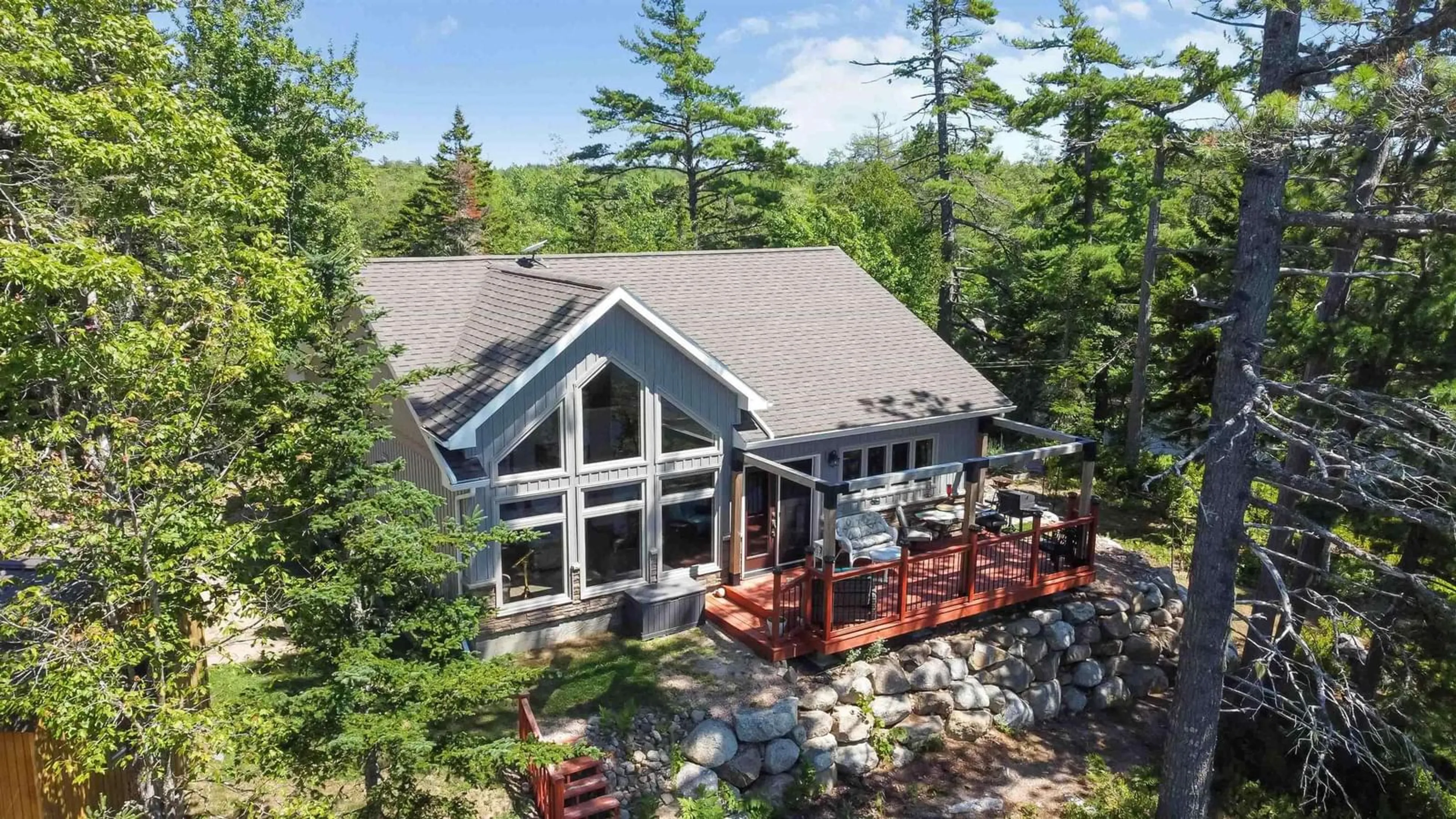 A pic from outside/outdoor area/front of a property/back of a property/a pic from drone, water/lake/river/ocean view for 37 Andrew Point Rd, Waterloo Lake Nova Scotia B0S 1P0