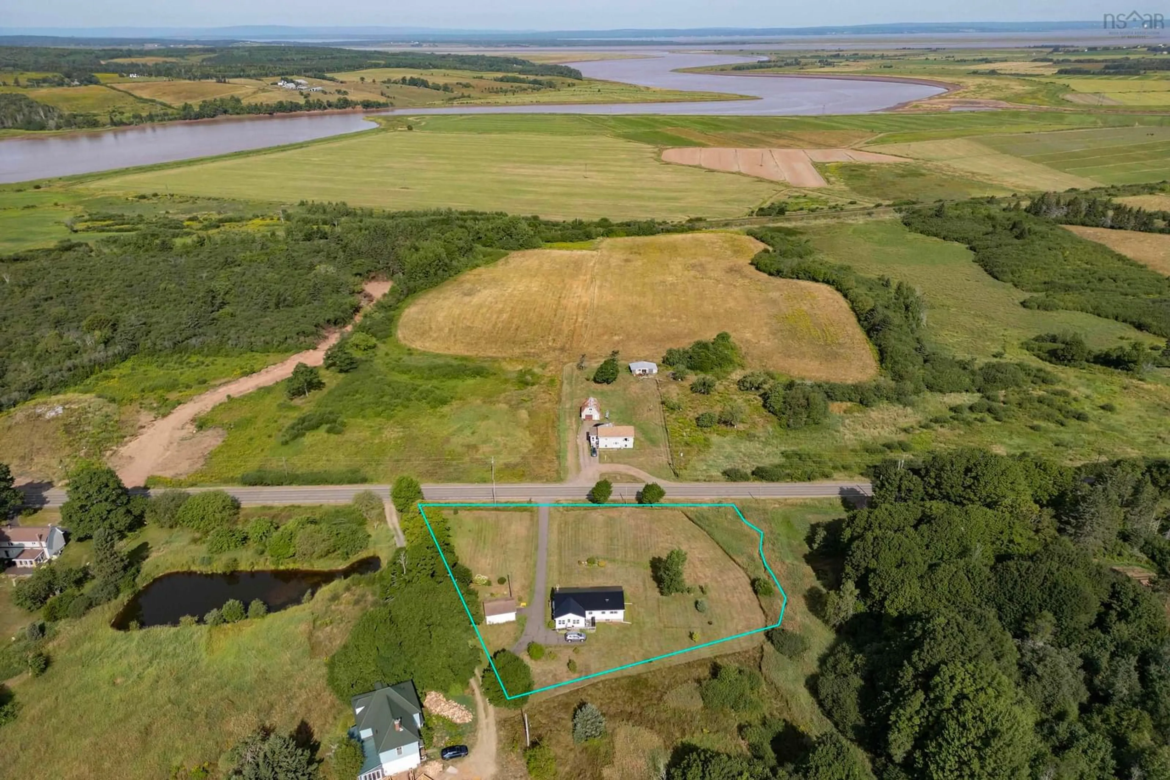 A pic from outside/outdoor area/front of a property/back of a property/a pic from drone, water/lake/river/ocean view for 3856 Highway 302, Nappan Nova Scotia B0L 1B0
