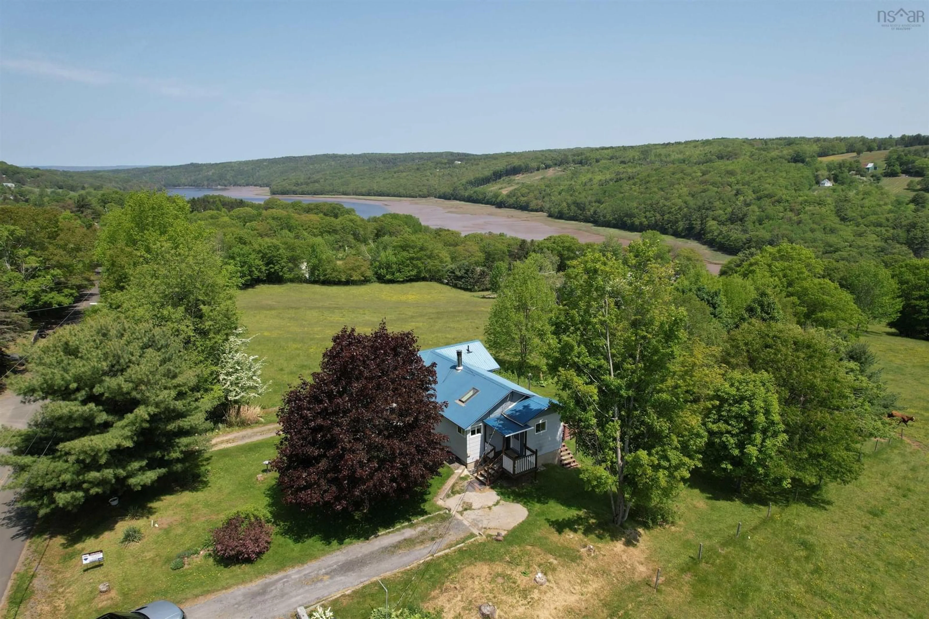A pic from outside/outdoor area/front of a property/back of a property/a pic from drone, water/lake/river/ocean view for 819 Riverview Rd, Bear River Nova Scotia B0S 1B0