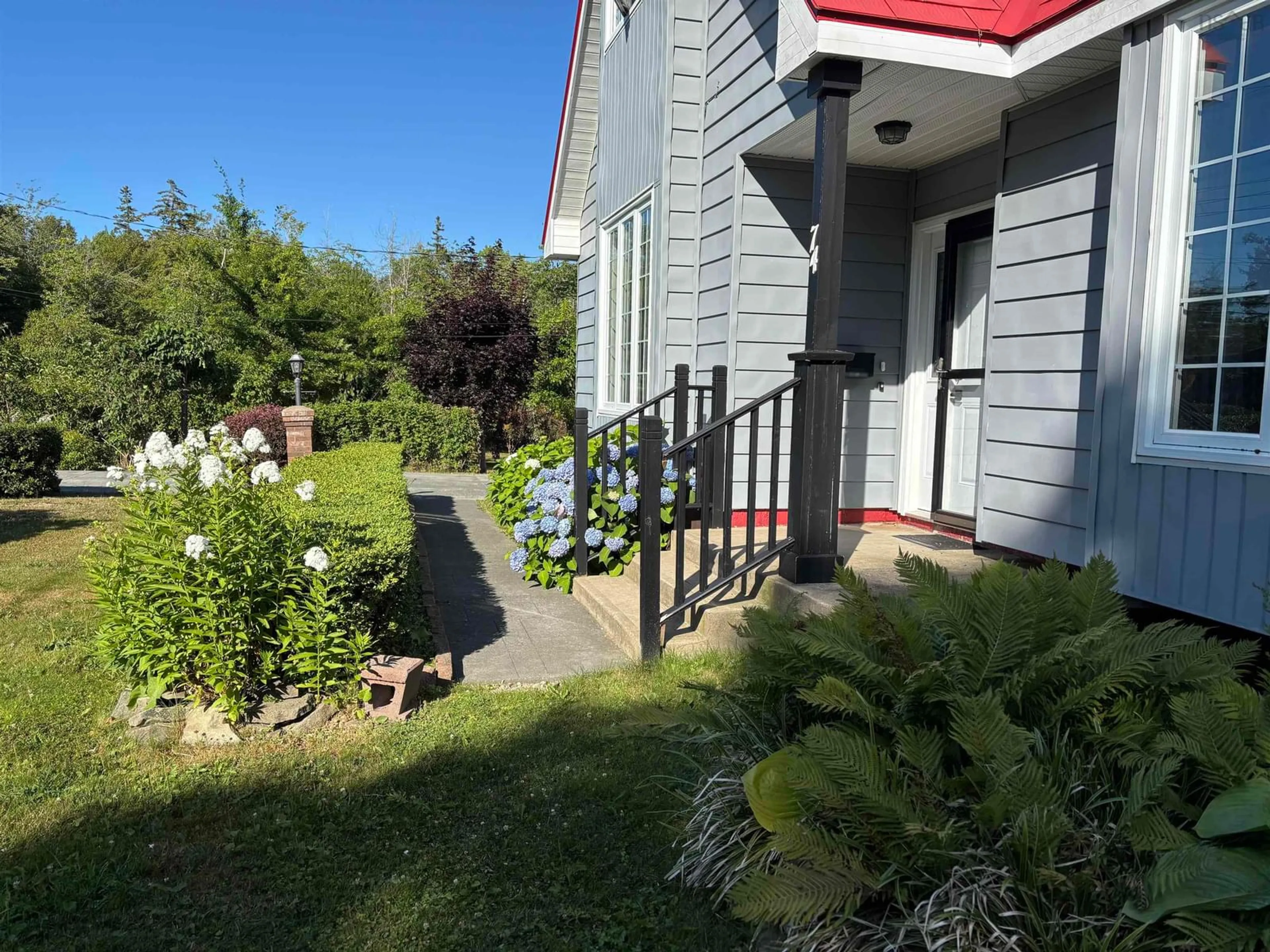A pic from outside/outdoor area/front of a property/back of a property/a pic from drone, street for 74 Sunrise Drive, Georges River Nova Scotia B1Y 3B8