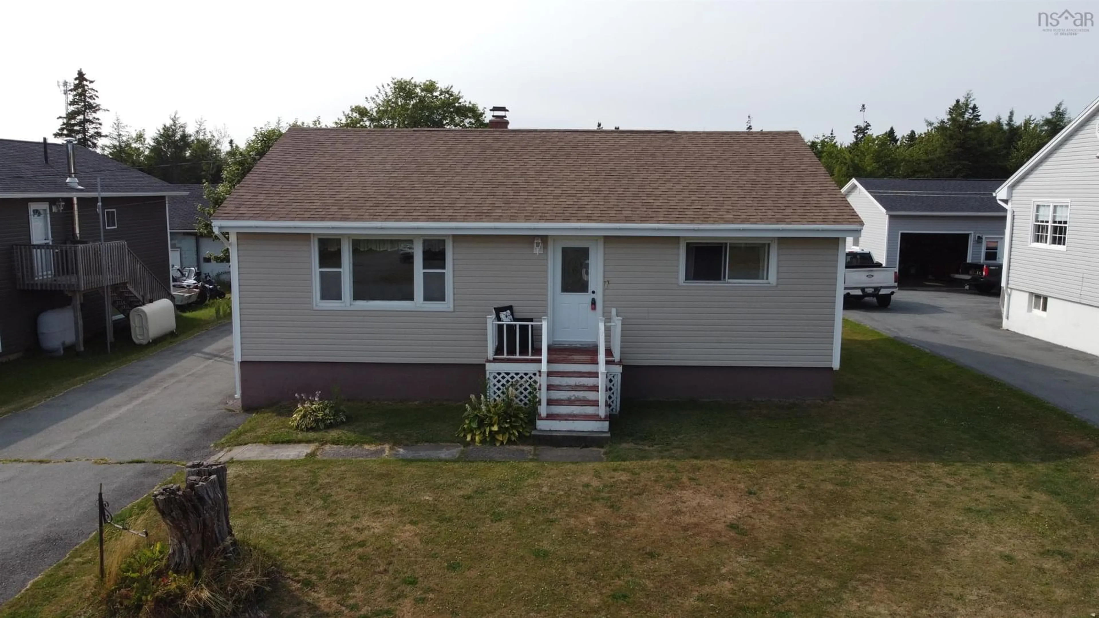 Home with vinyl exterior material, street for 70 Hornes Rd, Eastern Passage Nova Scotia B3G 1A4