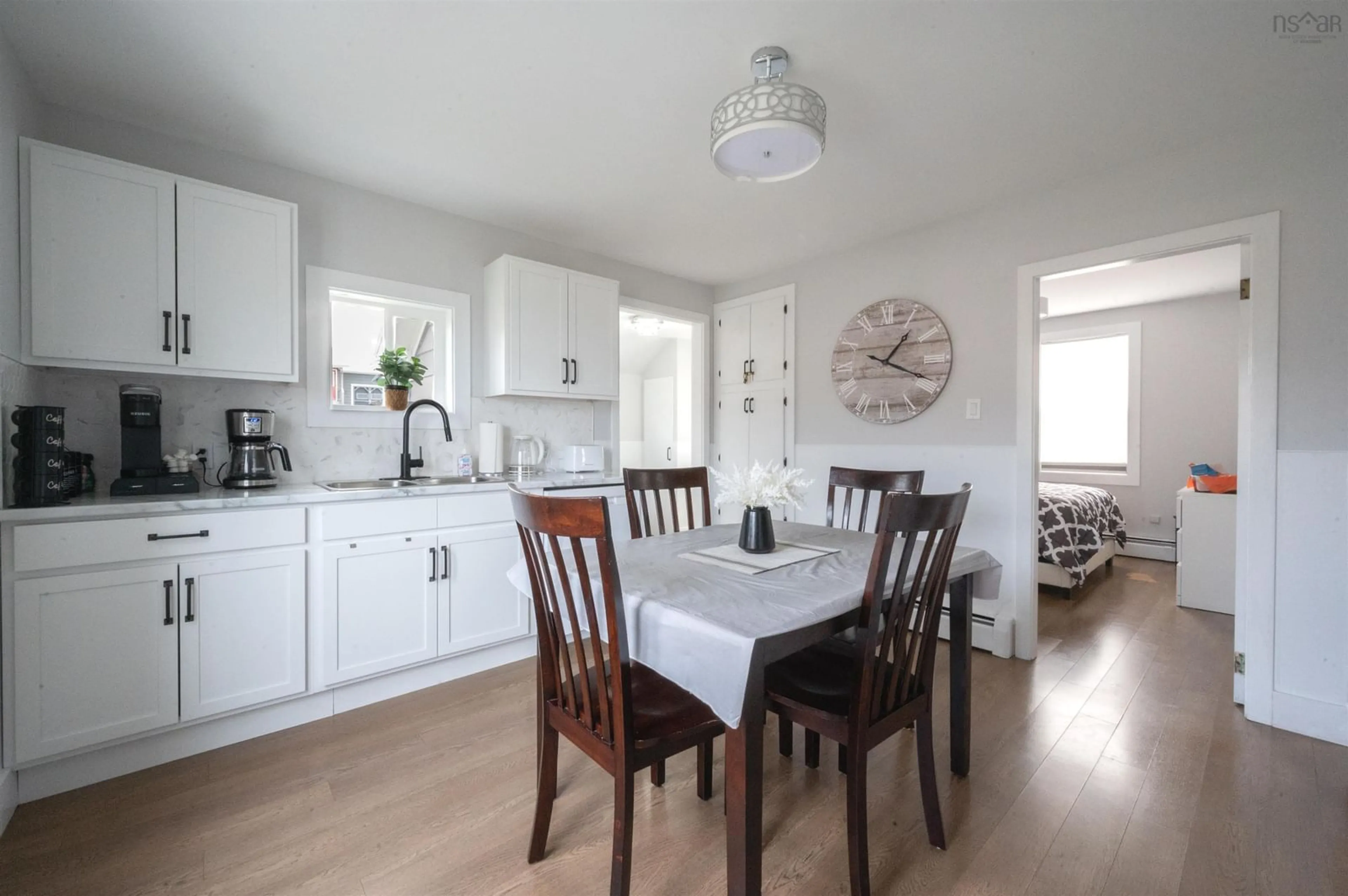 Open concept kitchen, wood/laminate floor for 9 Chemin De Susanne Rd, Chéticamp Nova Scotia B0E 1H0