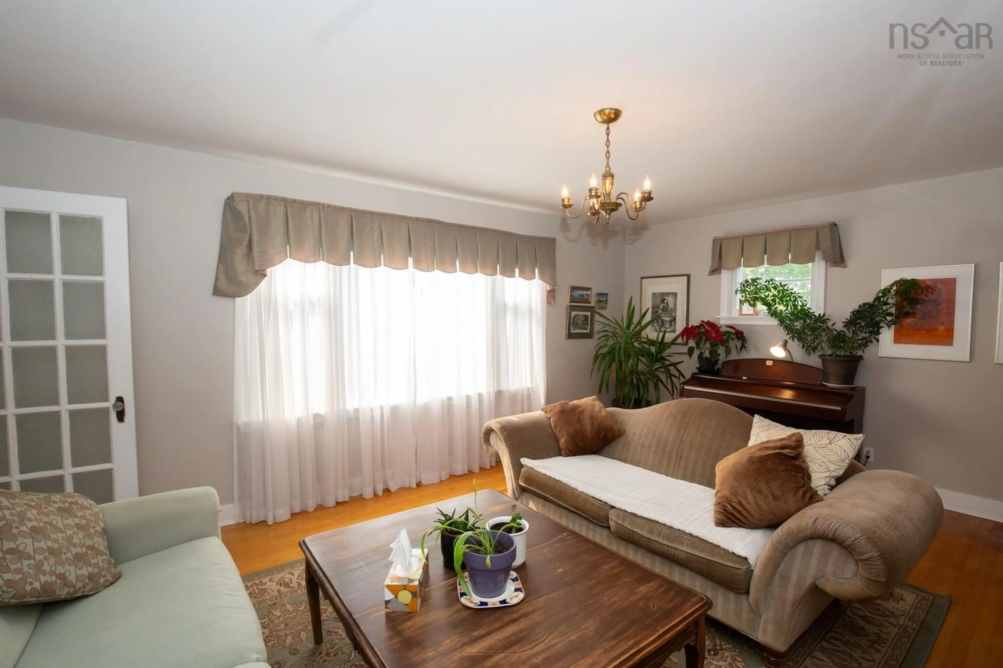 Living room with furniture, wood/laminate floor for 41 Archibald St, Truro Nova Scotia B2N 4R5
