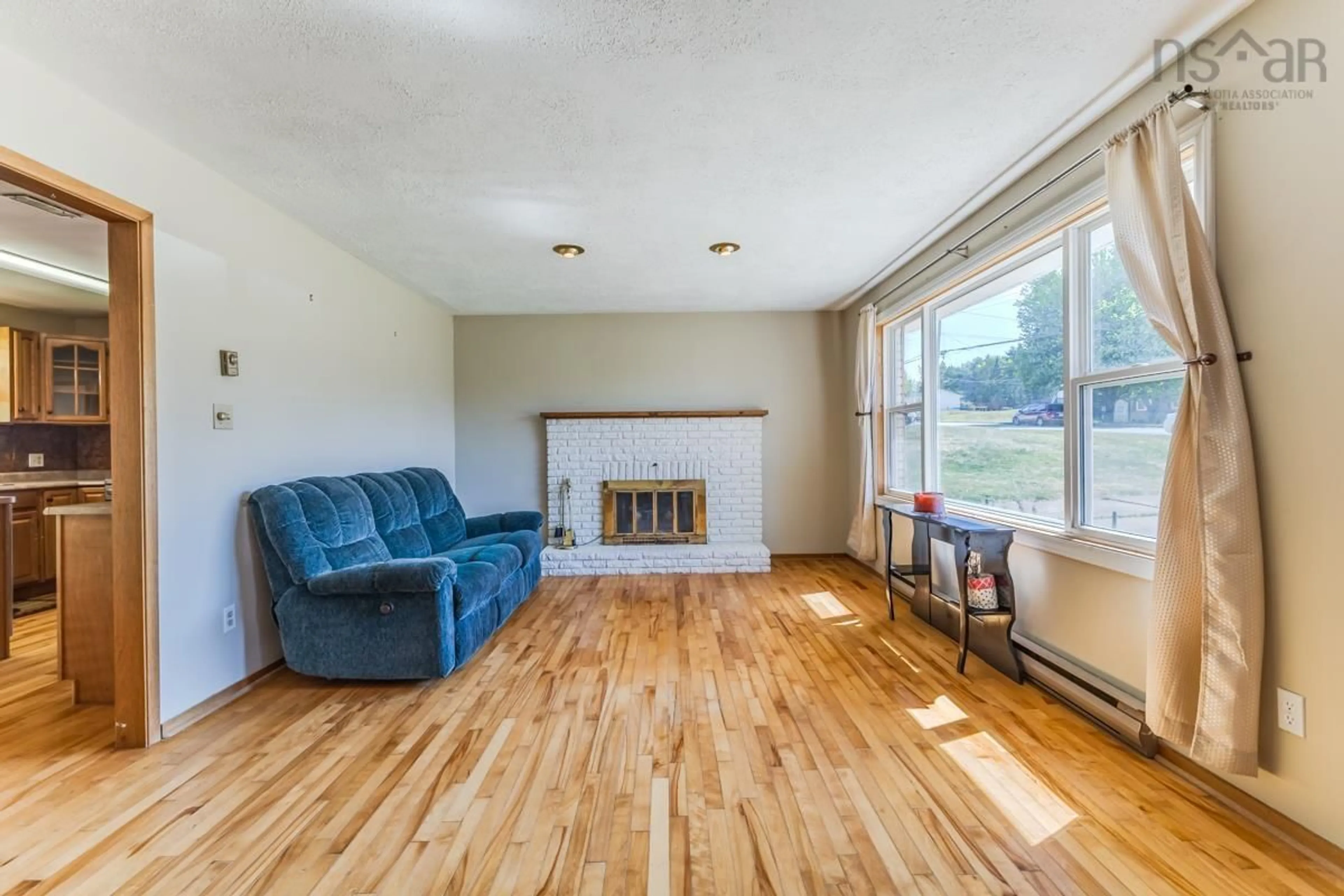 Living room with furniture, wood/laminate floor for 140 Spruce Dr, Salmon River Nova Scotia B2N 5R5