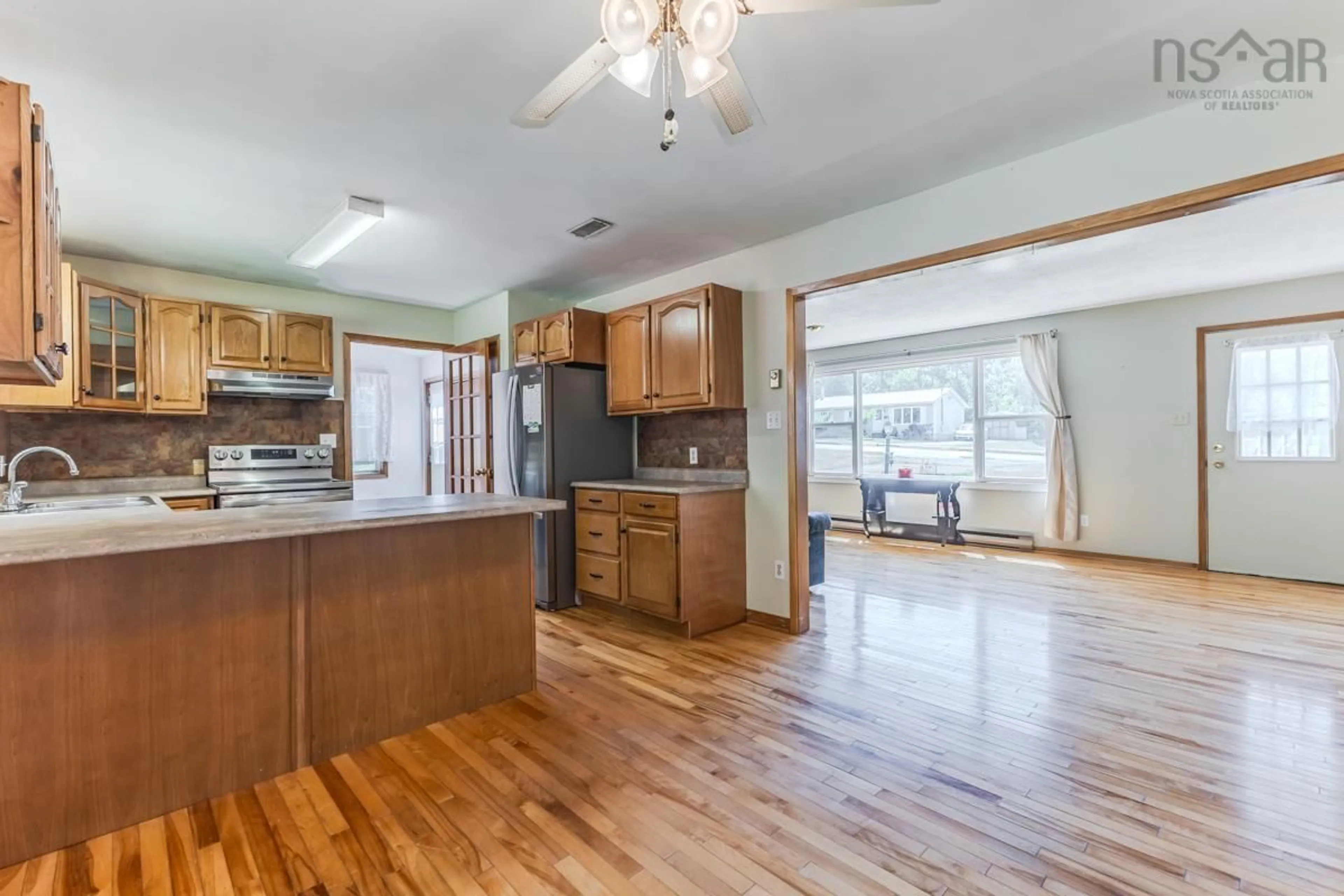 Open concept kitchen, wood/laminate floor for 140 Spruce Dr, Salmon River Nova Scotia B2N 5R5