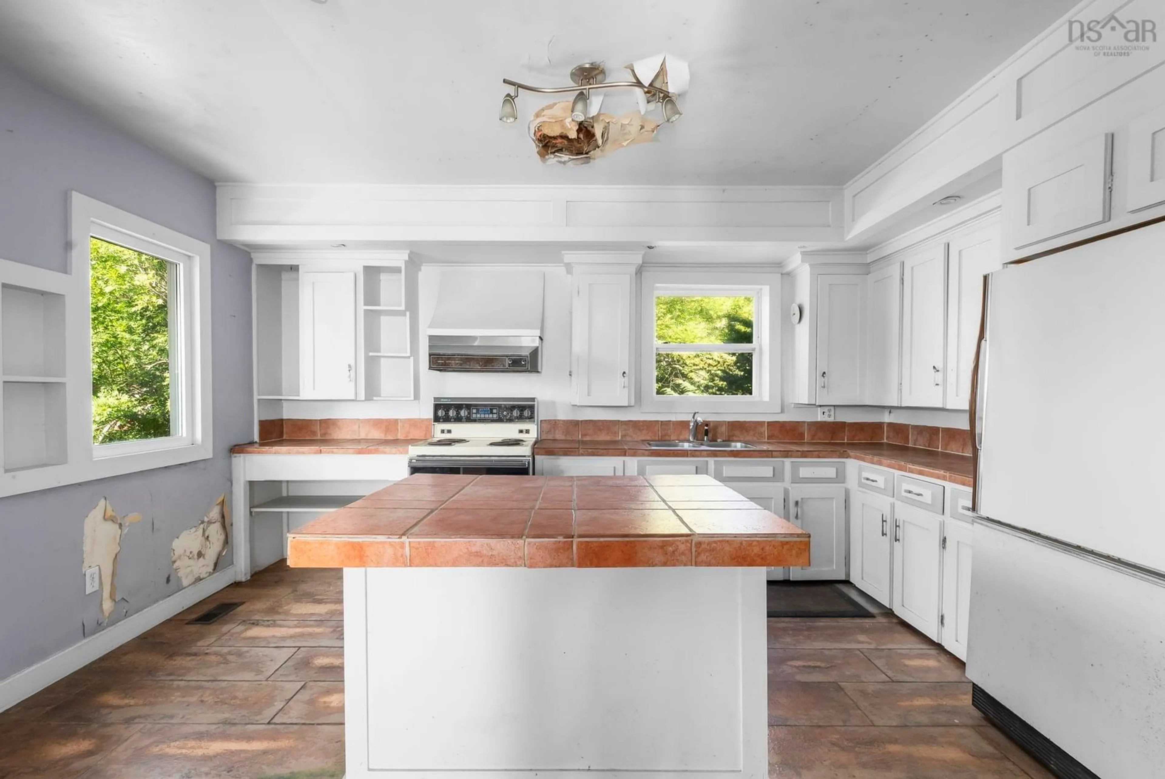 Open concept kitchen, ceramic/tile floor for 12 South Point Rd, Portuguese Cove Nova Scotia B3V 1K3