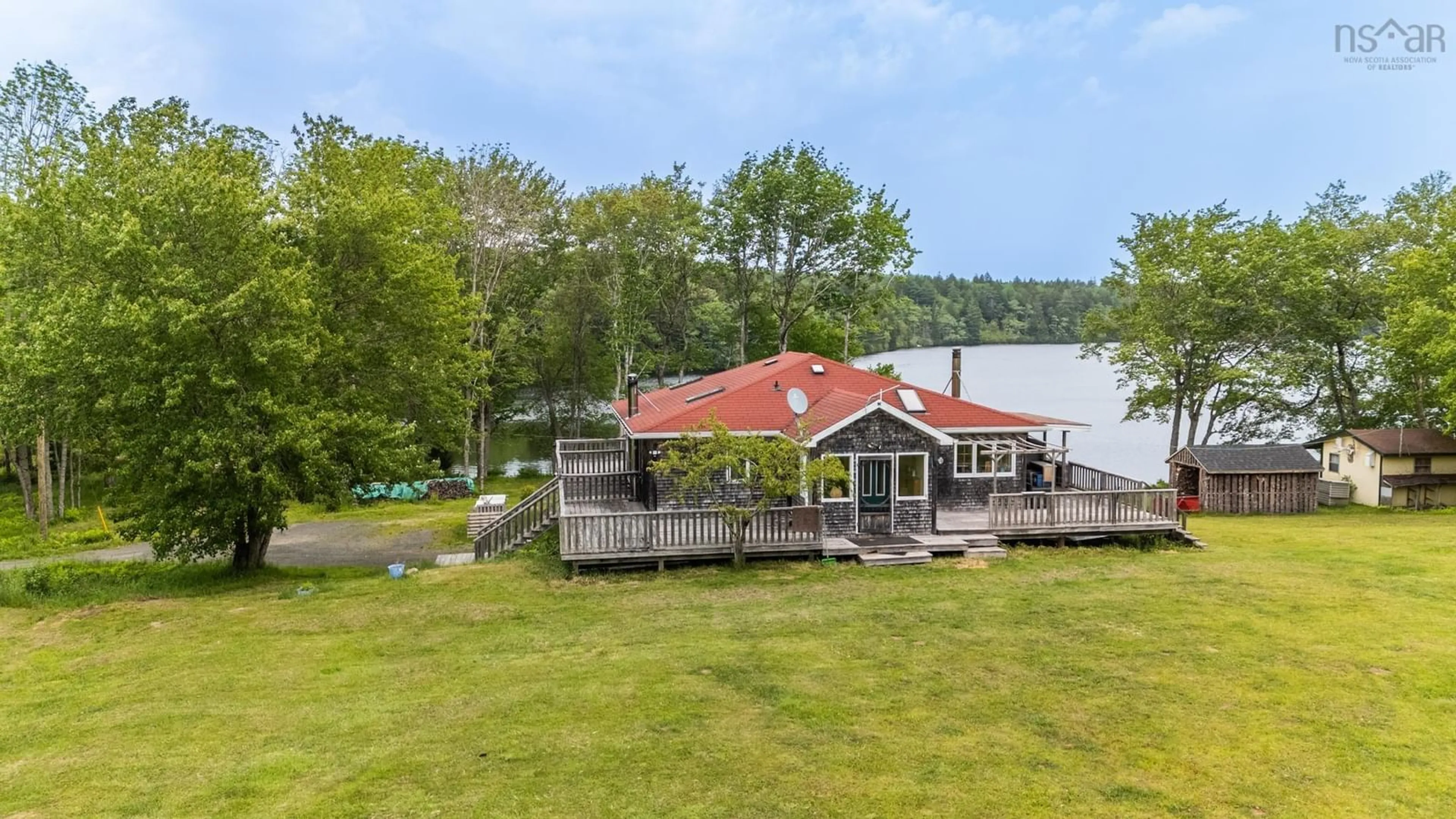 A pic from outside/outdoor area/front of a property/back of a property/a pic from drone, water/lake/river/ocean view for 956 Highway 203, Kemptville Nova Scotia B5A 5R3