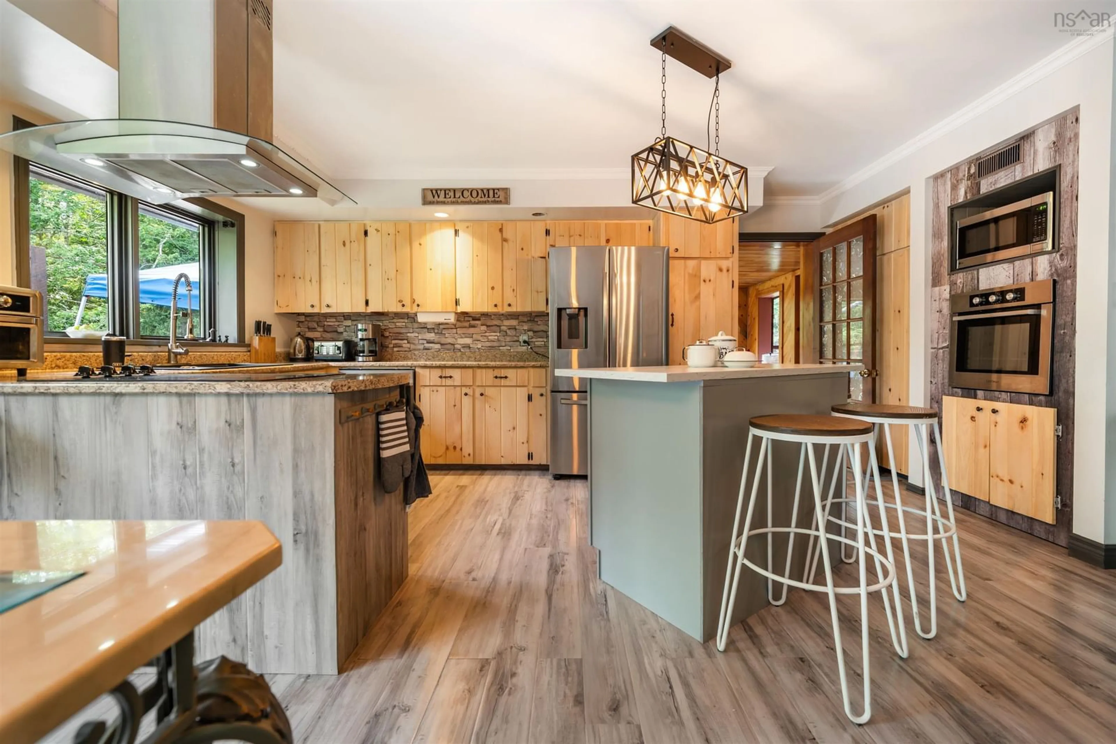Open concept kitchen, wood/laminate floor for 275 Harris Rd, Haliburton Nova Scotia B0K 1H0