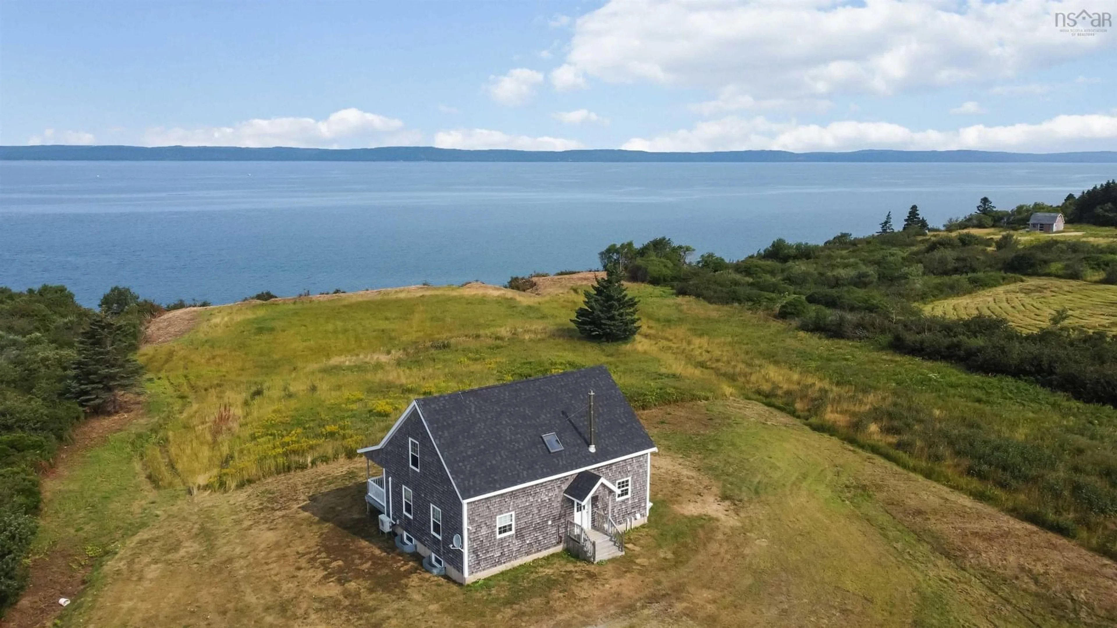 A pic from outside/outdoor area/front of a property/back of a property/a pic from drone, water/lake/river/ocean view for 885 Fort Point Rd, Ashmore Nova Scotia B0W 3T0