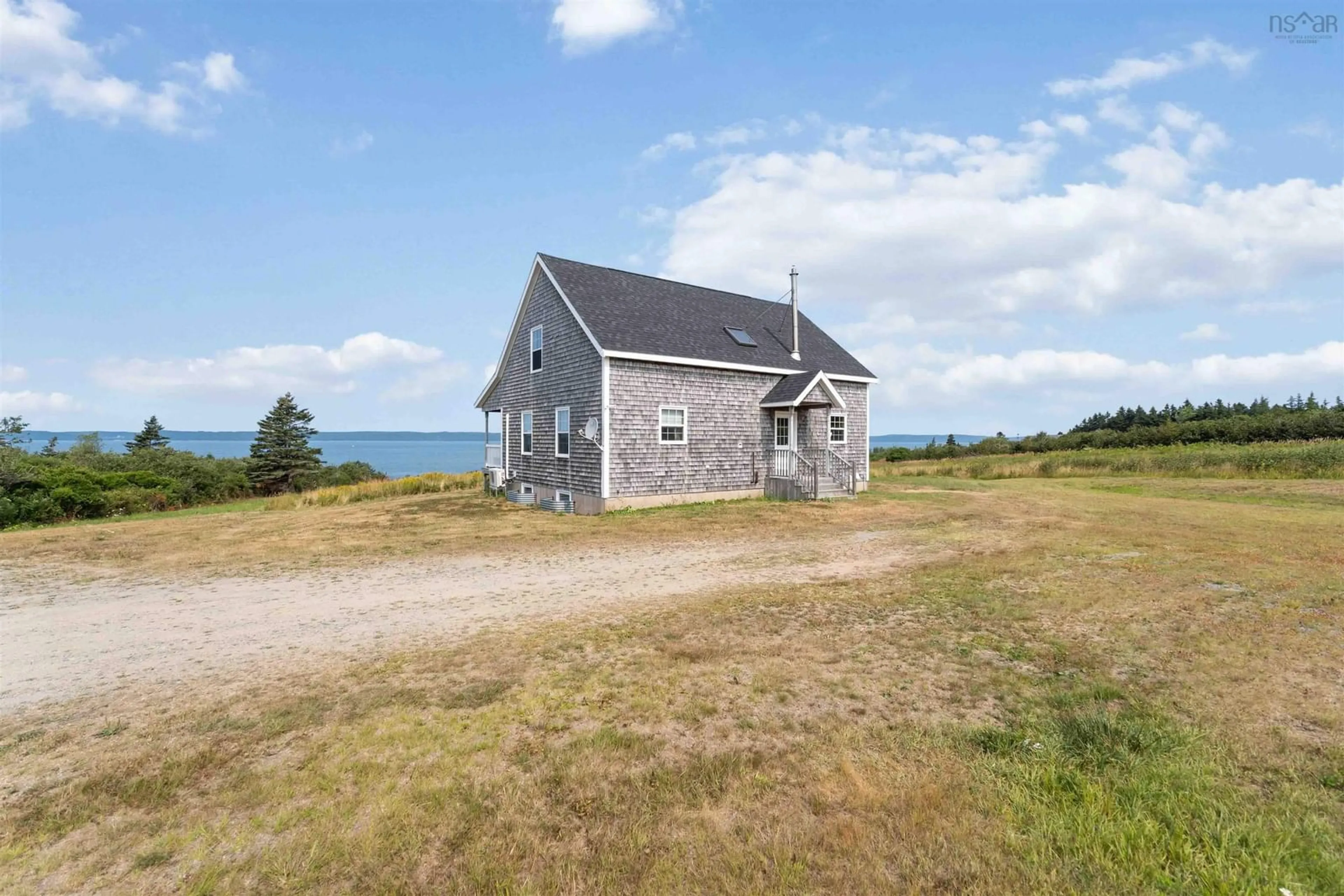 A pic from outside/outdoor area/front of a property/back of a property/a pic from drone, water/lake/river/ocean view for 885 Fort Point Rd, Ashmore Nova Scotia B0W 3T0