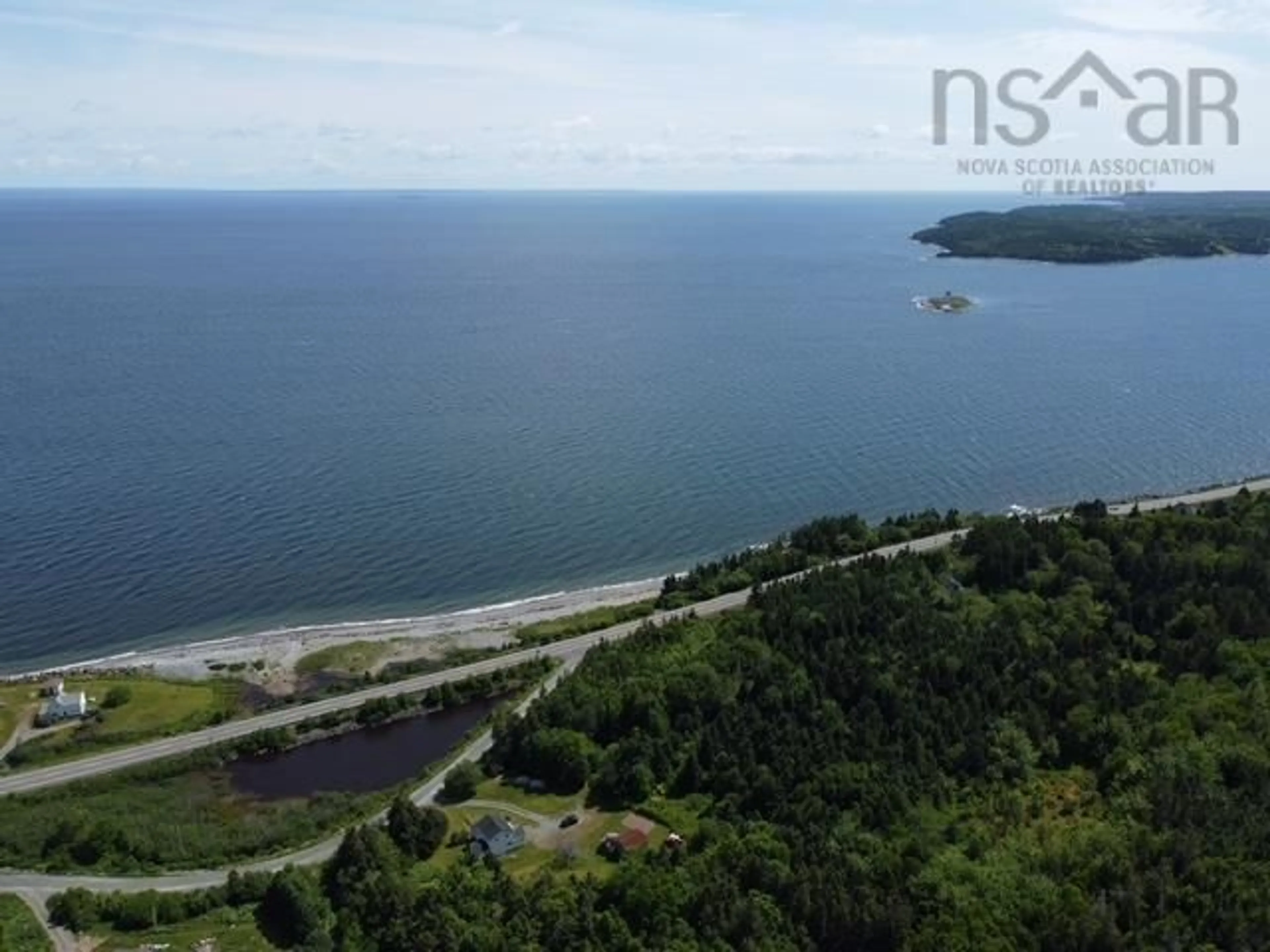 A pic from outside/outdoor area/front of a property/back of a property/a pic from drone, water/lake/river/ocean view for 5863 Highway 16 Queensport, Queensport Nova Scotia B0H 1N0