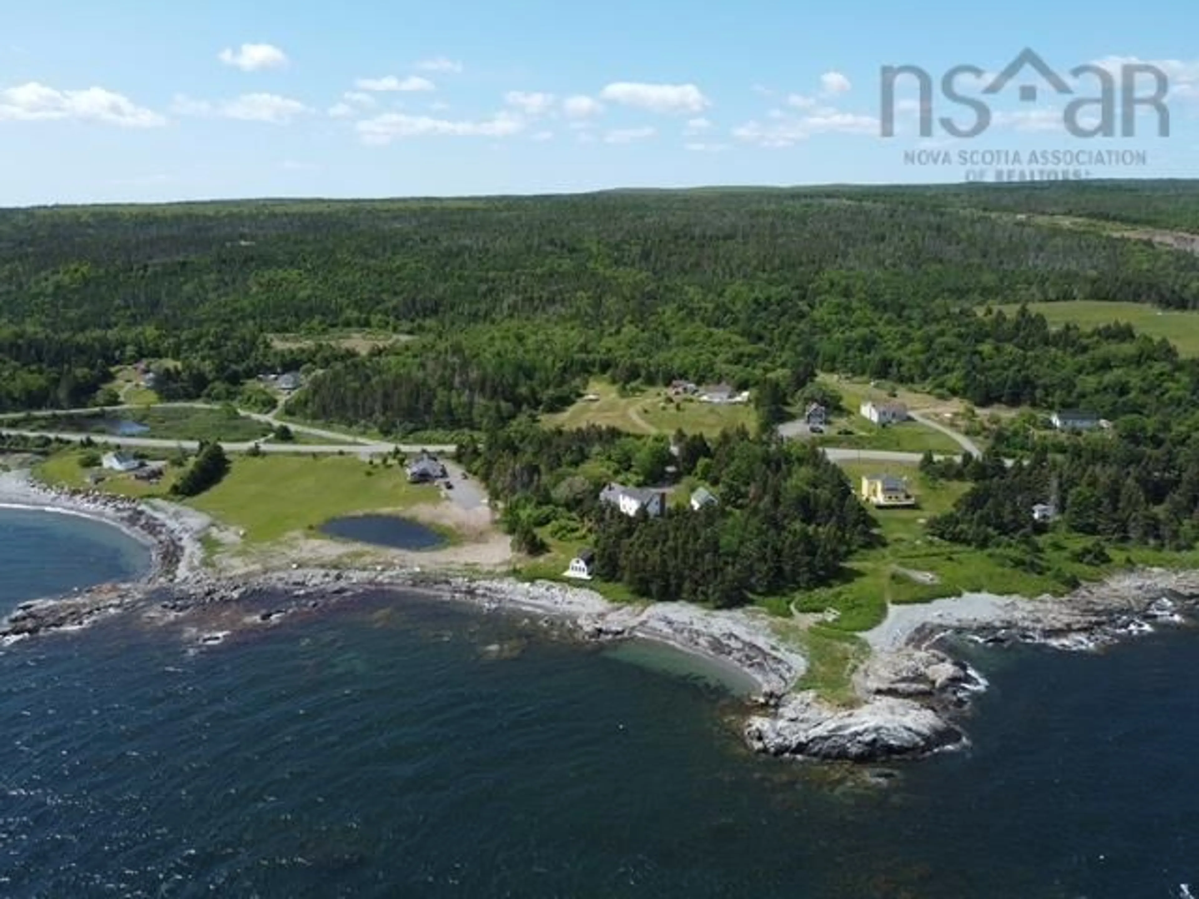 A pic from outside/outdoor area/front of a property/back of a property/a pic from drone, water/lake/river/ocean view for 5863 Highway 16 Queensport, Queensport Nova Scotia B0H 1N0