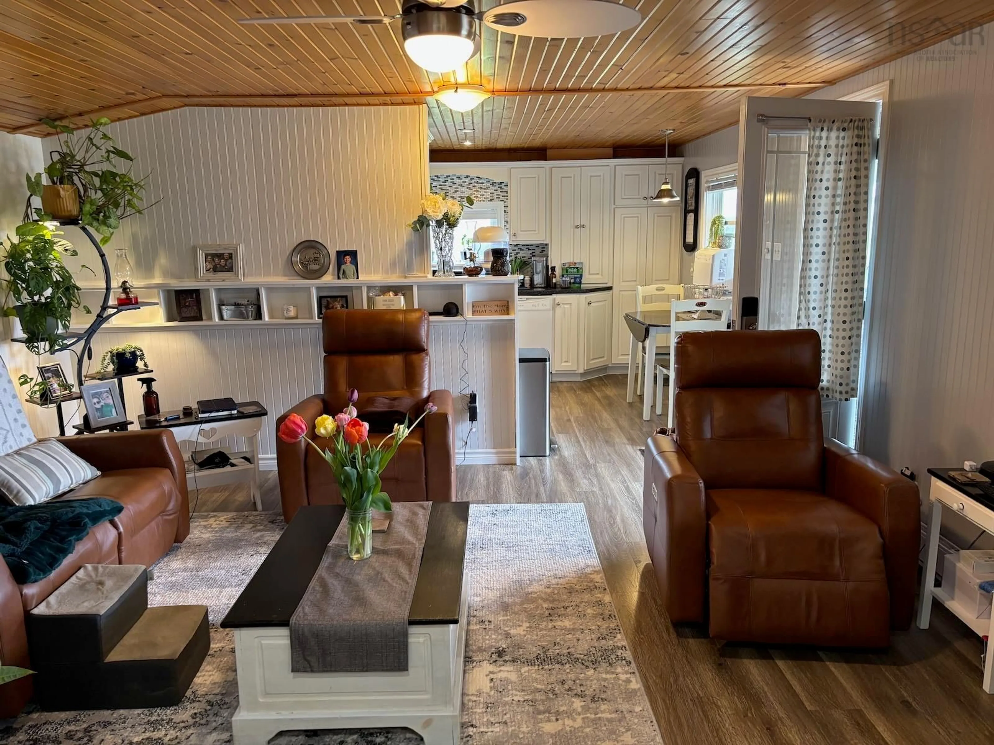 Living room with furniture, wood/laminate floor for 4173 Highway 340 #340, Carleton Nova Scotia B5A 5P9