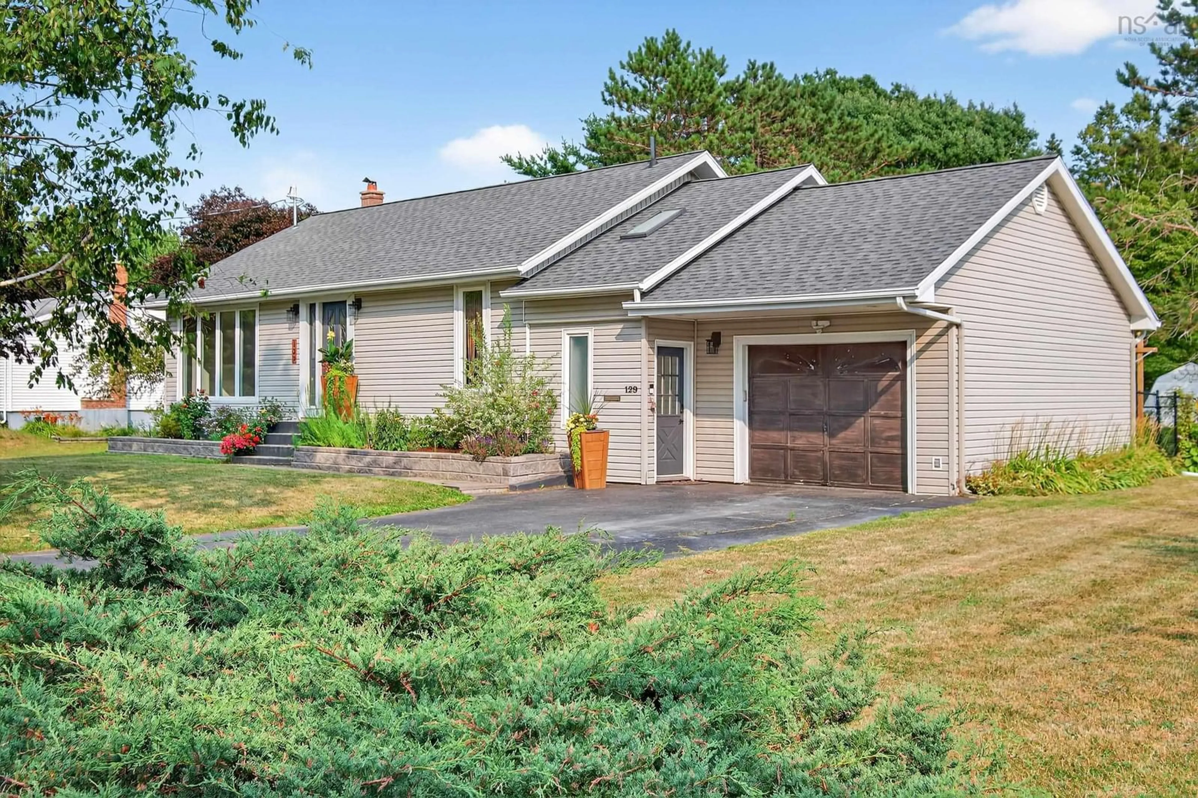 Home with vinyl exterior material, street for 129 Thompson Avenue, Sydney River Nova Scotia B1S 1L3