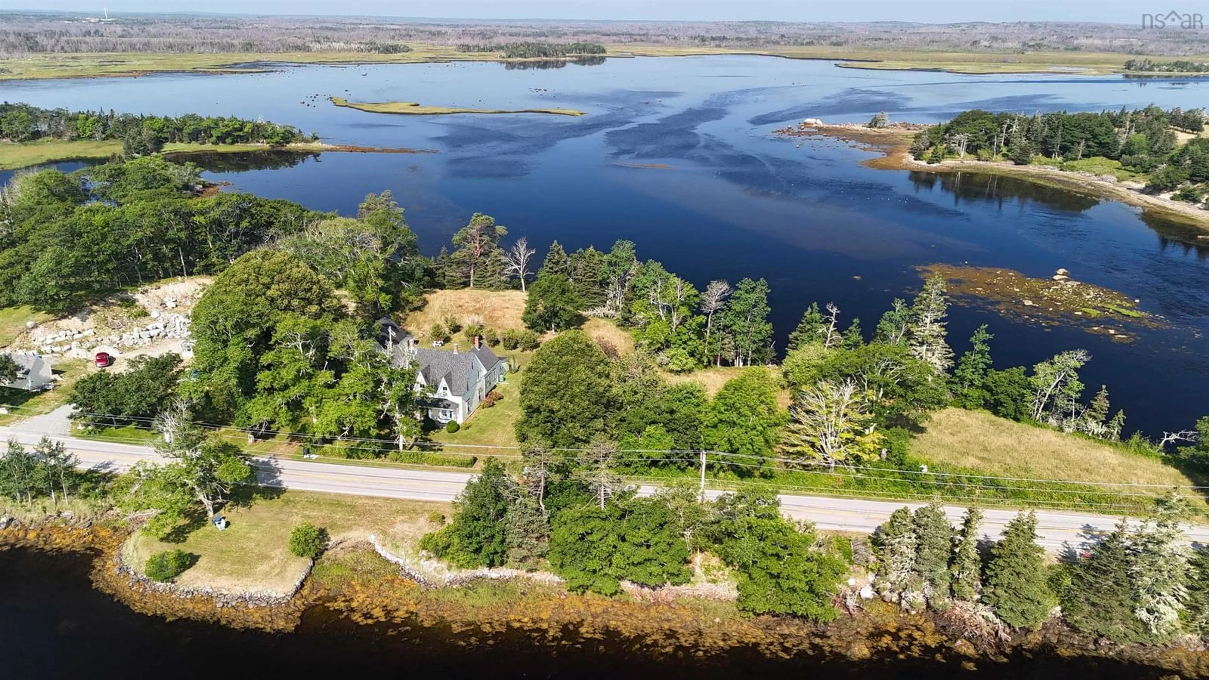 A pic from outside/outdoor area/front of a property/back of a property/a pic from drone, water/lake/river/ocean view for 54 Port Latour Rd, Port Clyde Nova Scotia B0W 1R0