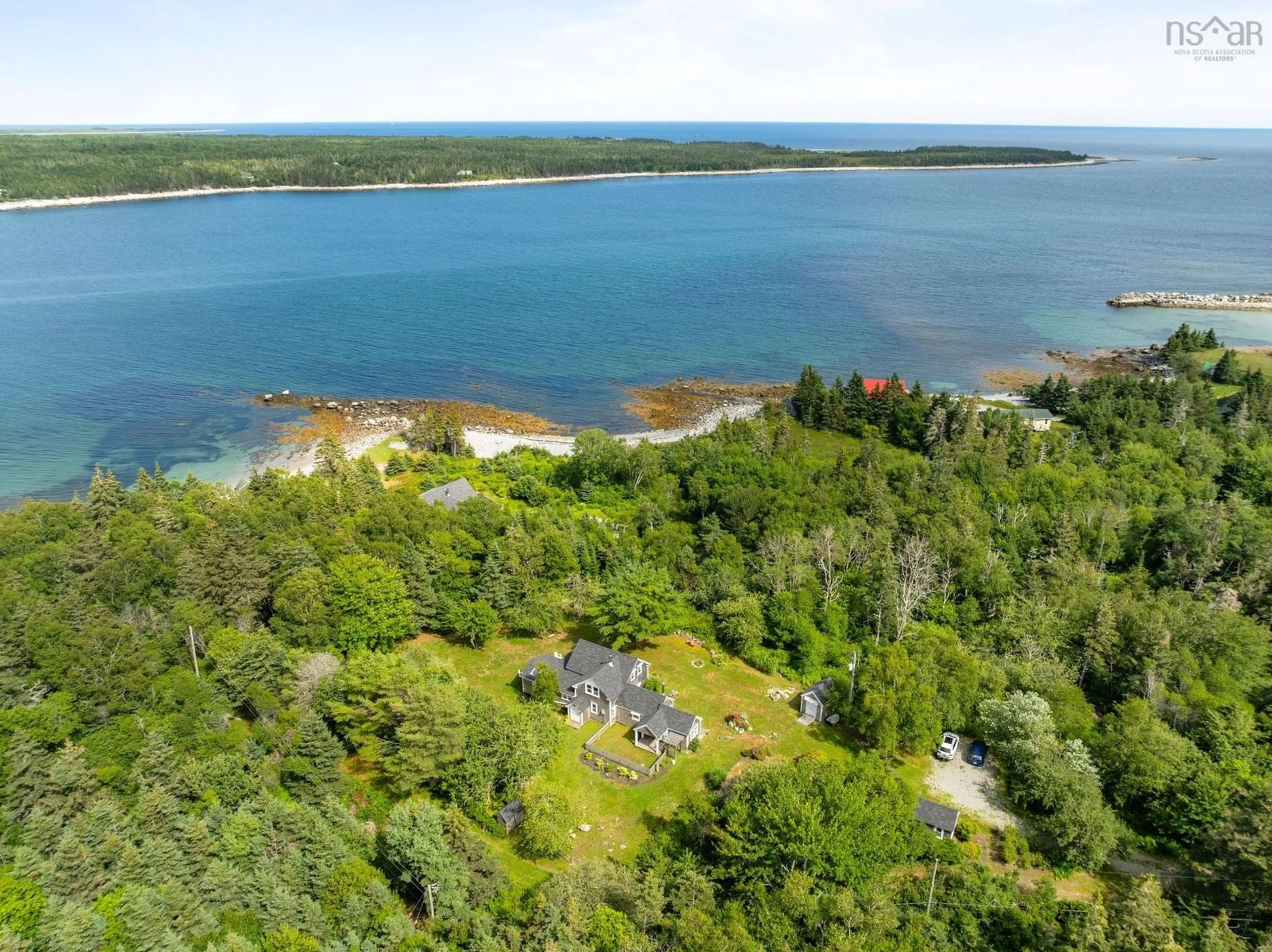 A pic from outside/outdoor area/front of a property/back of a property/a pic from drone, water/lake/river/ocean view for 60 River Rd, Port L'Hebert Nova Scotia B0T 1V0