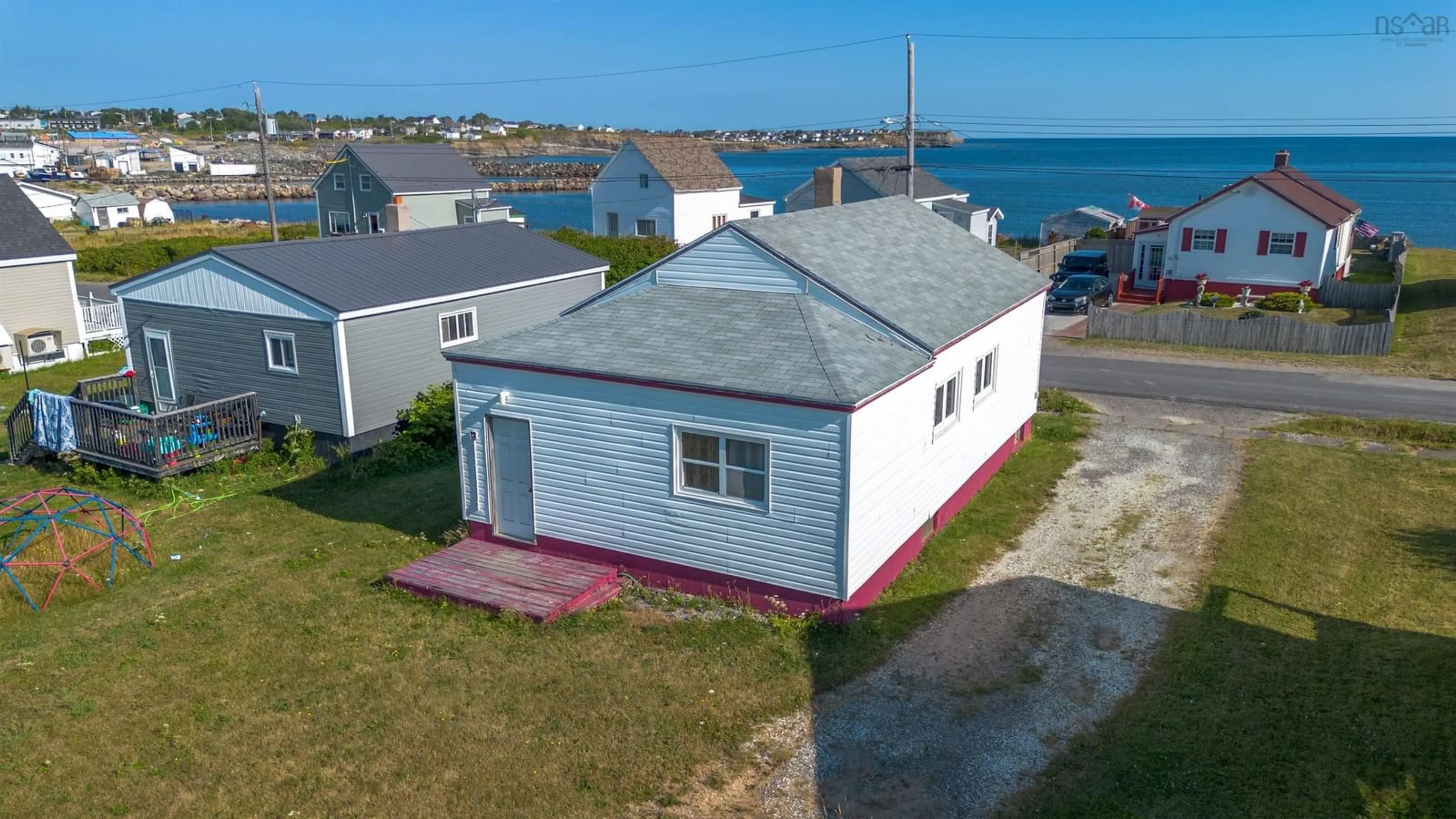 A pic from outside/outdoor area/front of a property/back of a property/a pic from drone, water/lake/river/ocean view for 32 Wadman St, Glace Bay Nova Scotia B1A 1S3