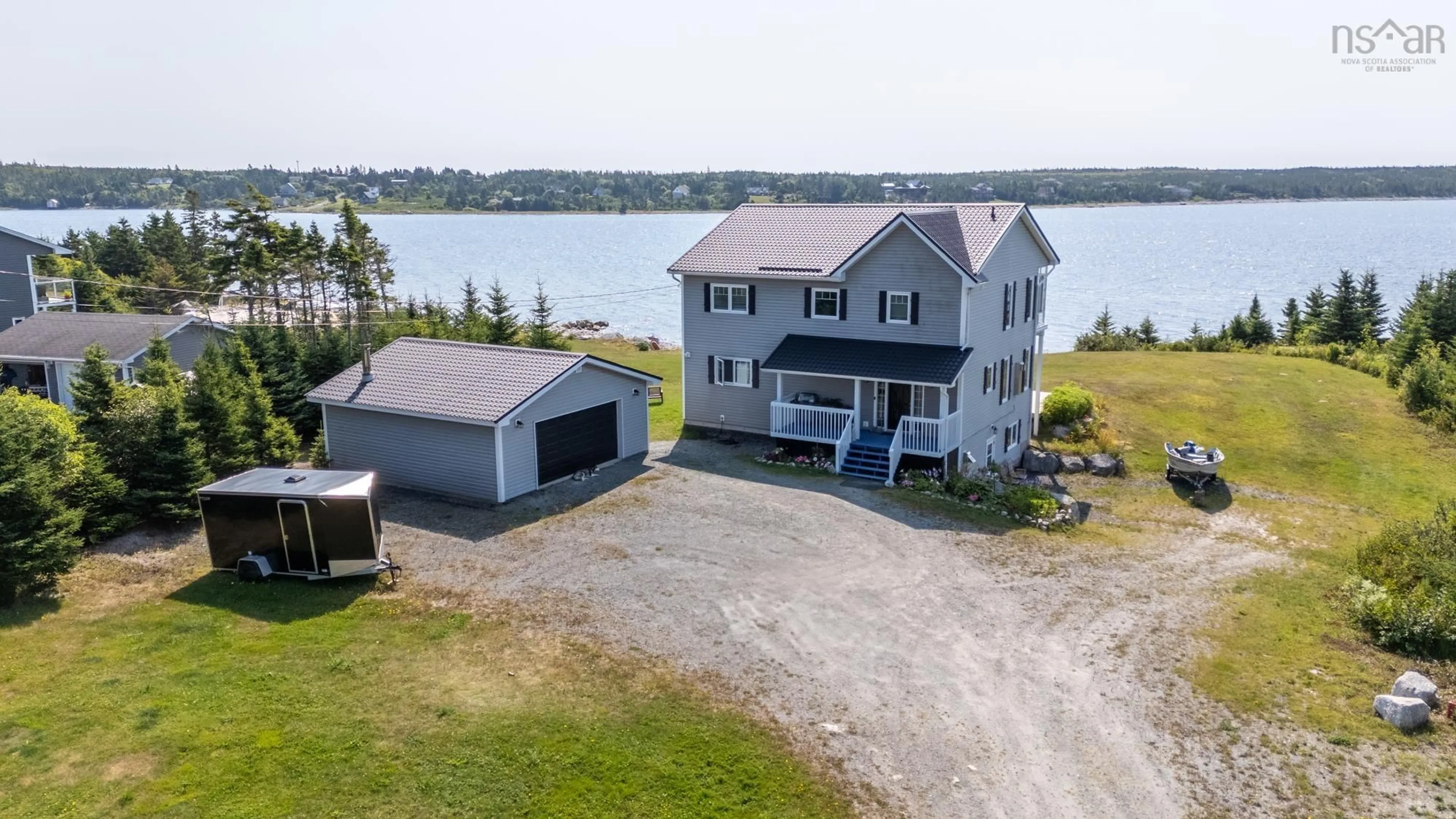 A pic from outside/outdoor area/front of a property/back of a property/a pic from drone, water/lake/river/ocean view for 102 Oceantide Lane, West Pennant Nova Scotia B3V 0E9