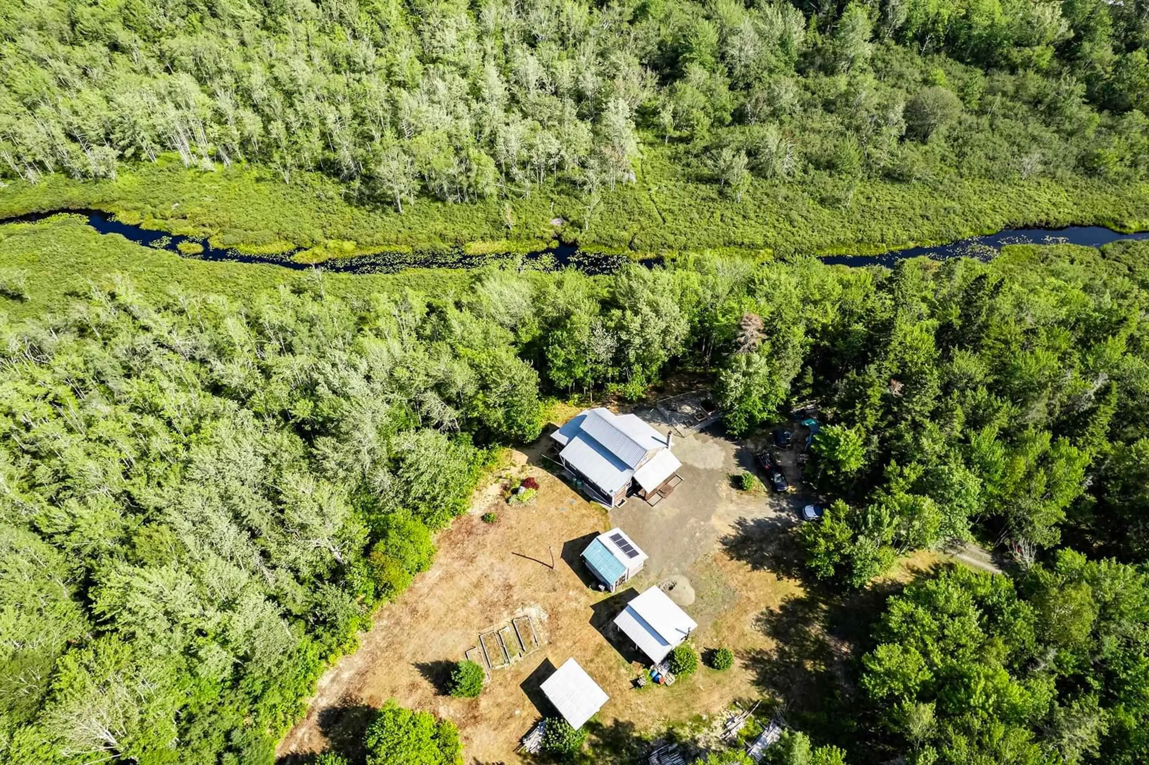 A pic from outside/outdoor area/front of a property/back of a property/a pic from drone, forest/trees view for 5052 Clementsvale Rd, Princedale Nova Scotia B0S 1G0