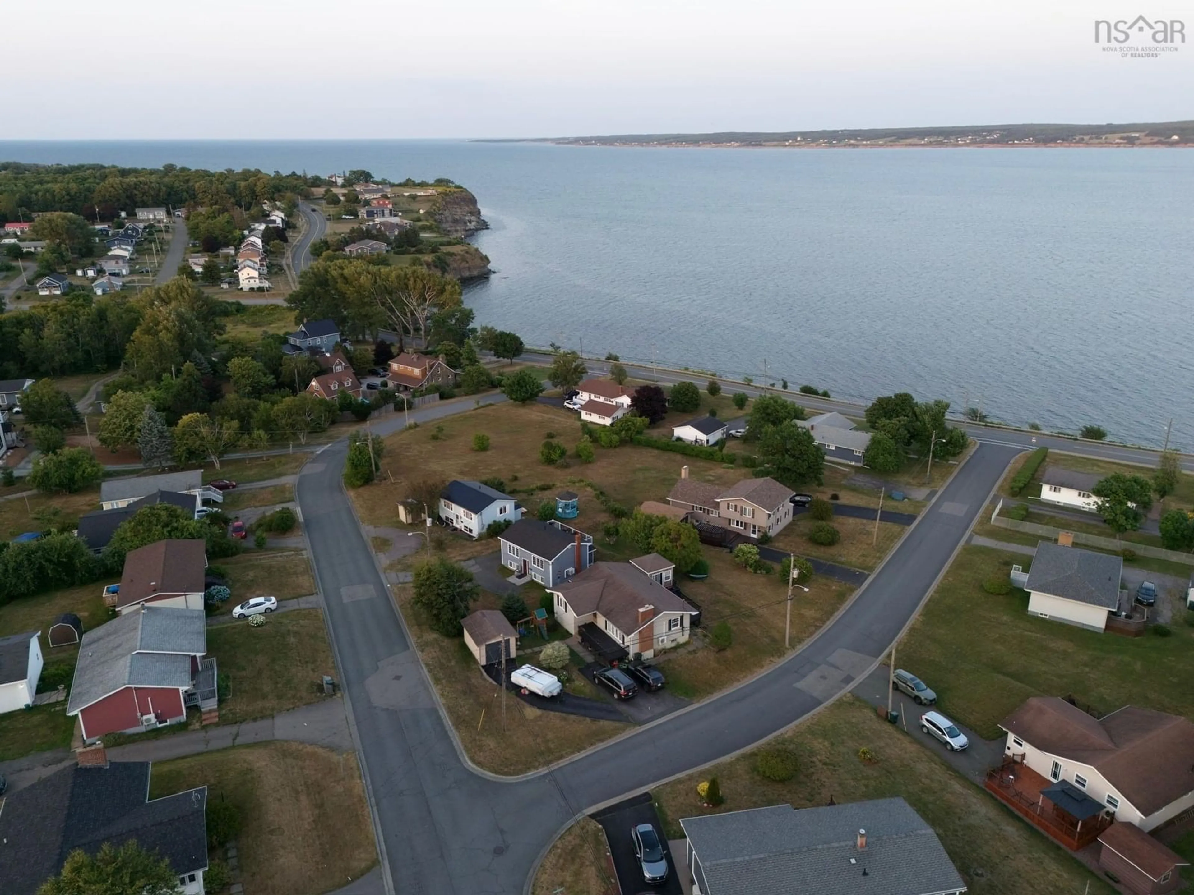 A pic from outside/outdoor area/front of a property/back of a property/a pic from drone, water/lake/river/ocean view for 21 Waterview Dr, Sydney Mines Nova Scotia B1V 1B9