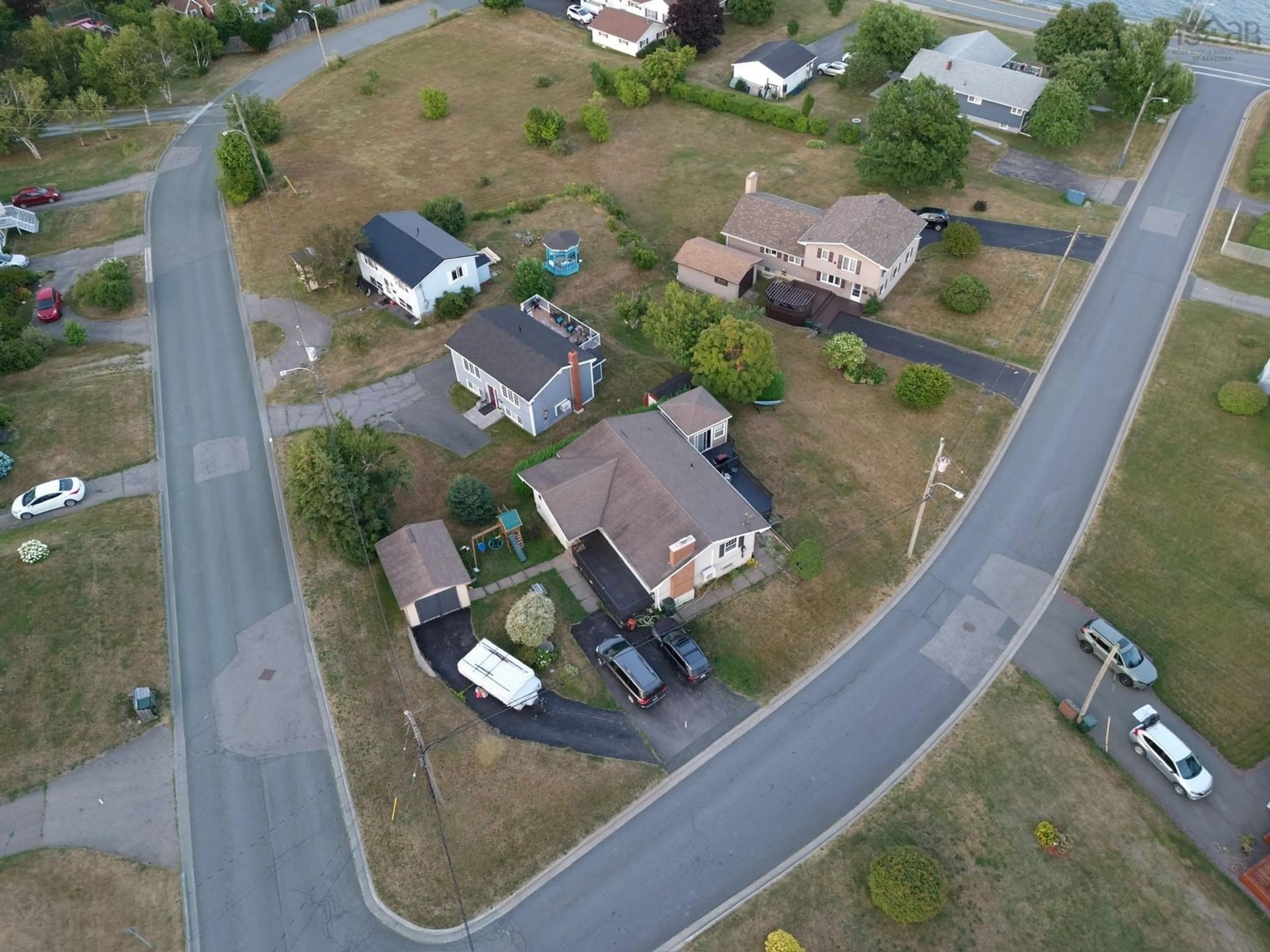 A pic from outside/outdoor area/front of a property/back of a property/a pic from drone, street for 21 Waterview Dr, Sydney Mines Nova Scotia B1V 1B9