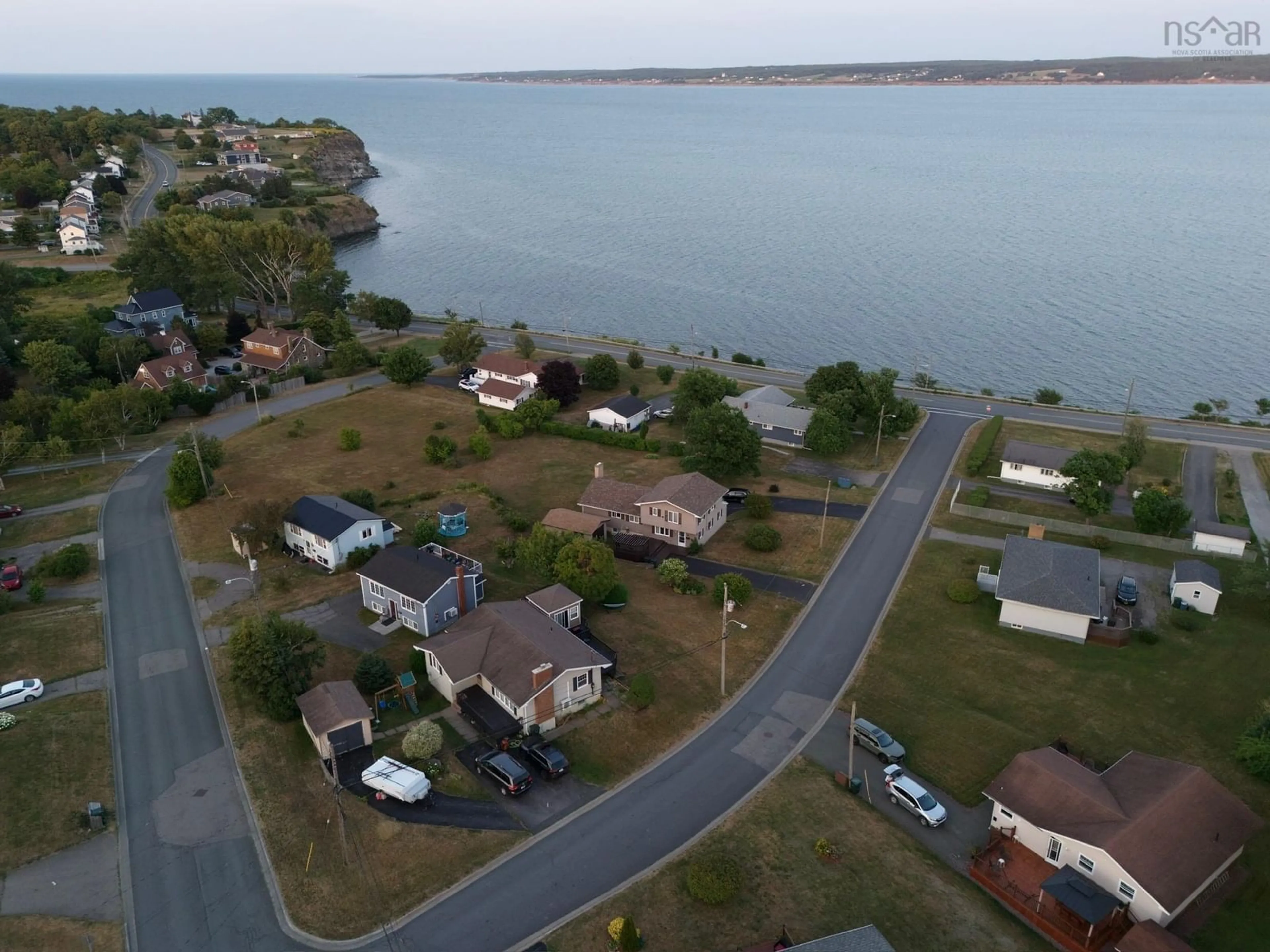 A pic from outside/outdoor area/front of a property/back of a property/a pic from drone, water/lake/river/ocean view for 21 Waterview Dr, Sydney Mines Nova Scotia B1V 1B9