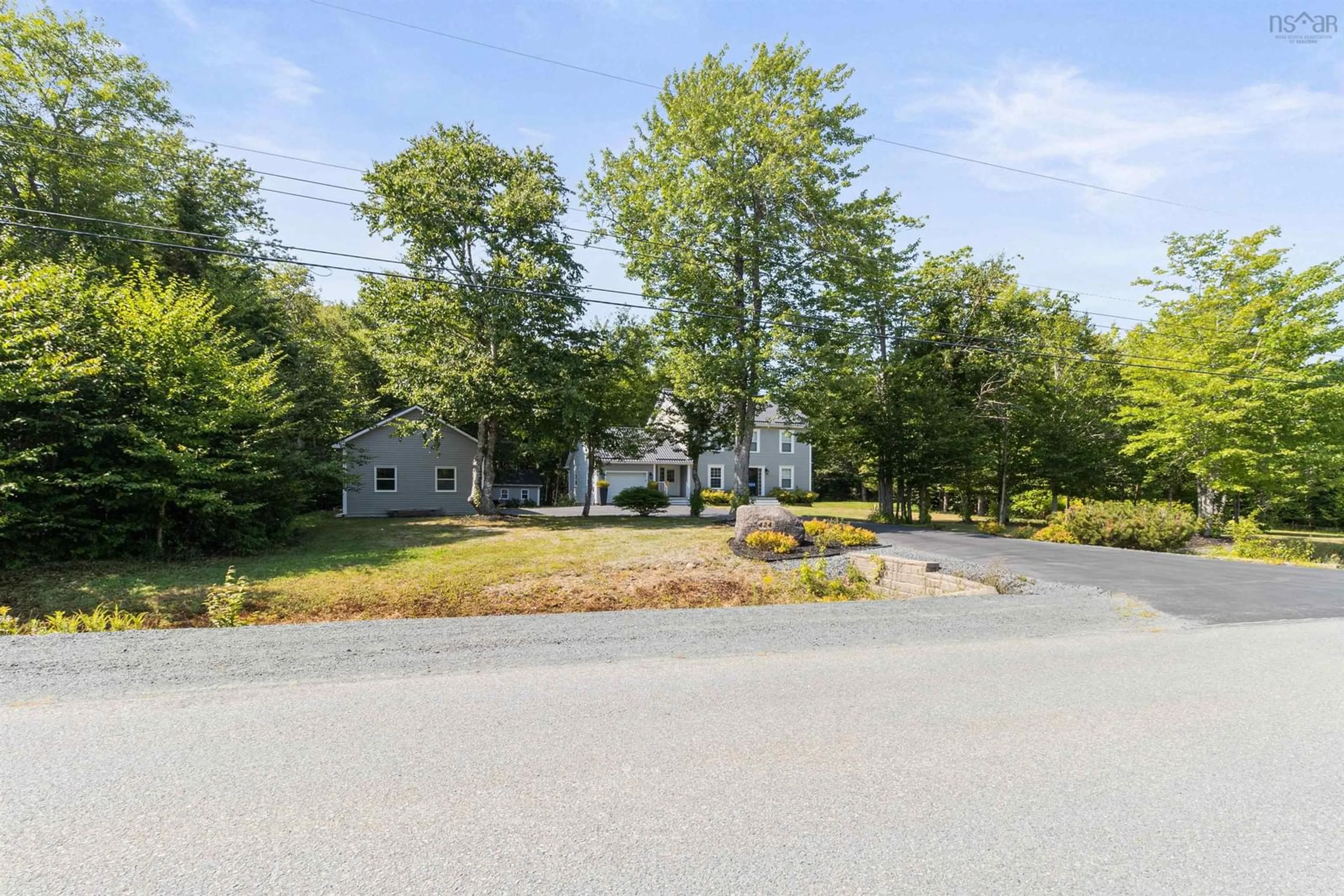 A pic from outside/outdoor area/front of a property/back of a property/a pic from drone, street for 424 Tattenham Cres, Hammonds Plains Nova Scotia B4B 1V3