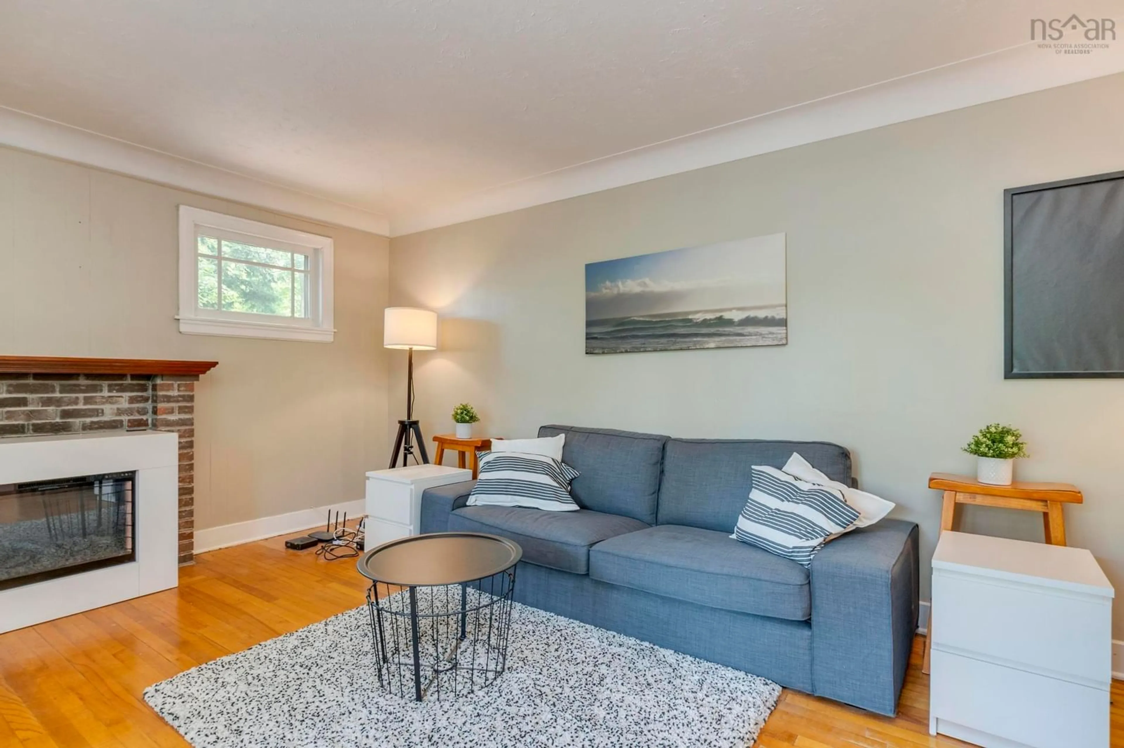 Living room with furniture, wood/laminate floor for 10 Howe Ave, Fall River Nova Scotia B2T 1H7