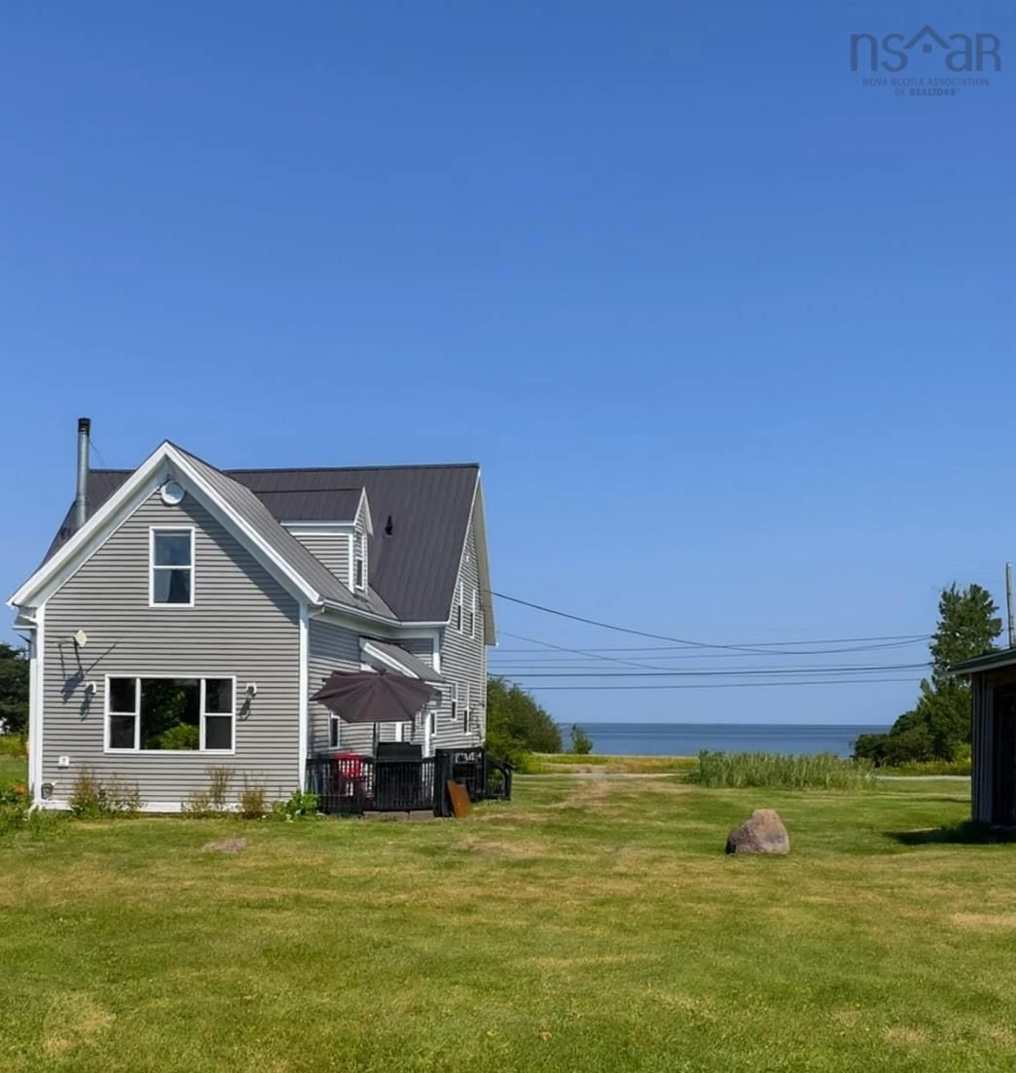 A pic from outside/outdoor area/front of a property/back of a property/a pic from drone, water/lake/river/ocean view for 8396 Highway 6, West Pugwash Nova Scotia B0K 1L0