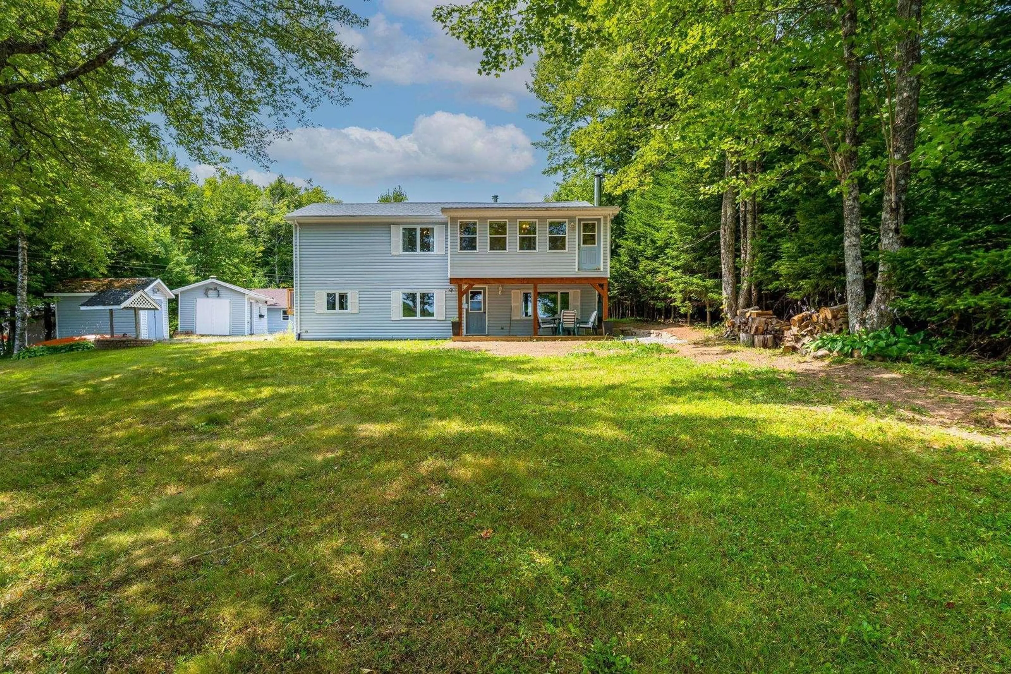 A pic from outside/outdoor area/front of a property/back of a property/a pic from drone, water/lake/river/ocean view for 88 Lake Lewis Lane, New Russell Nova Scotia B0J 2M0