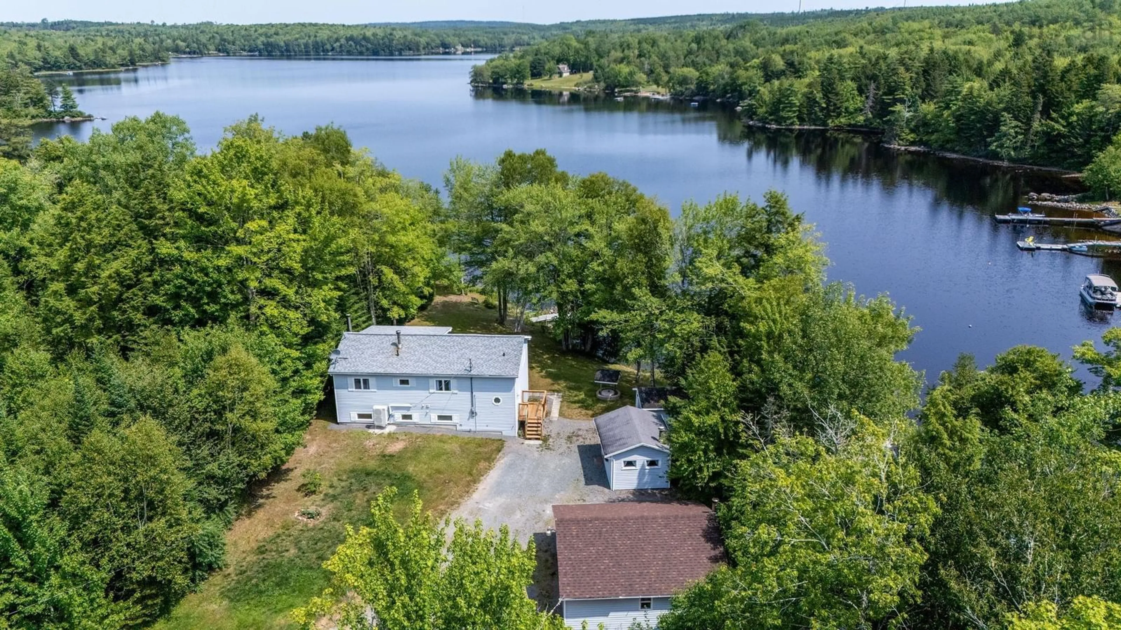 A pic from outside/outdoor area/front of a property/back of a property/a pic from drone, water/lake/river/ocean view for 88 Lake Lewis Lane, New Russell Nova Scotia B0J 2M0