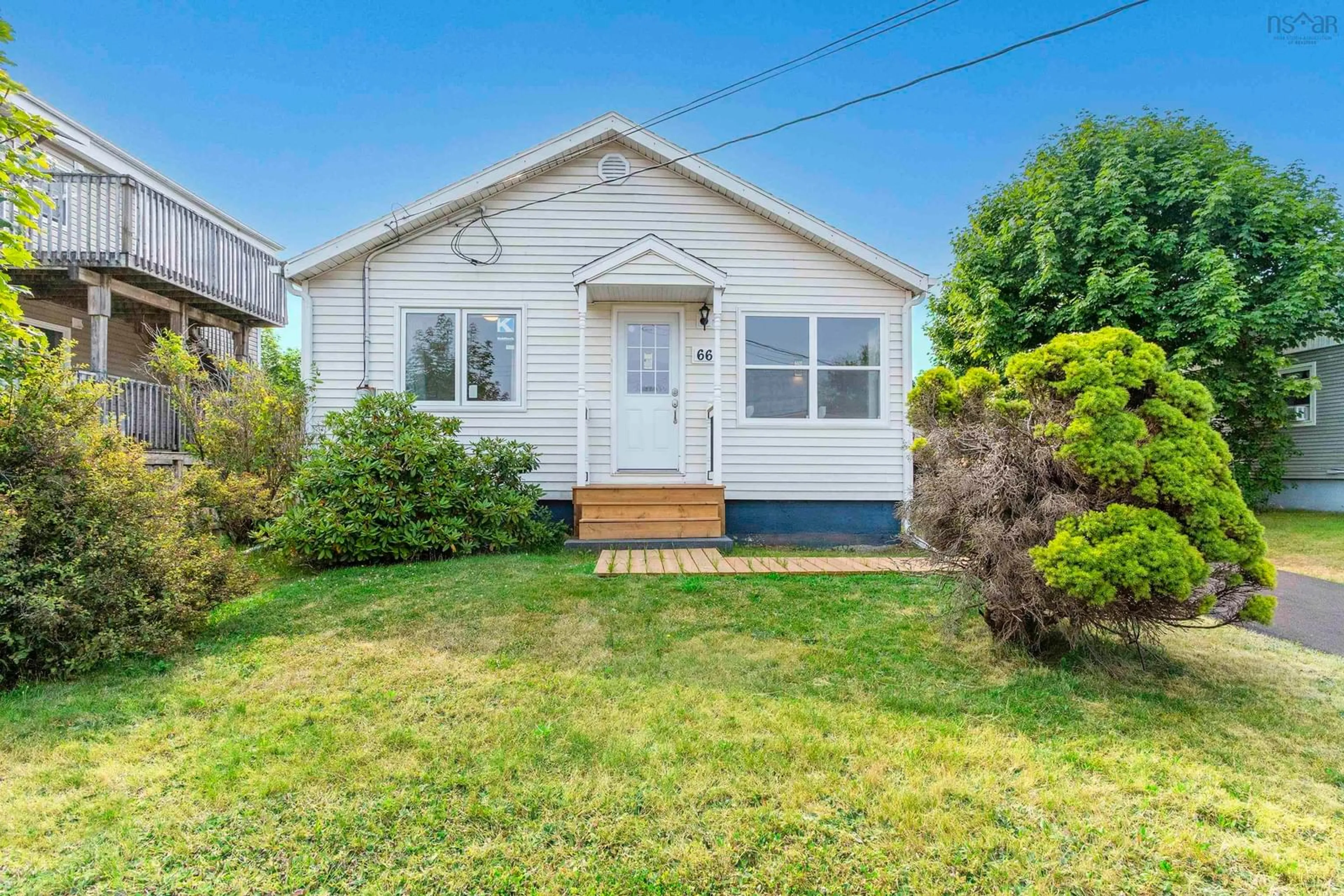 Home with vinyl exterior material, street for 66 Woodland Ave, Dartmouth Nova Scotia B3A 3K1