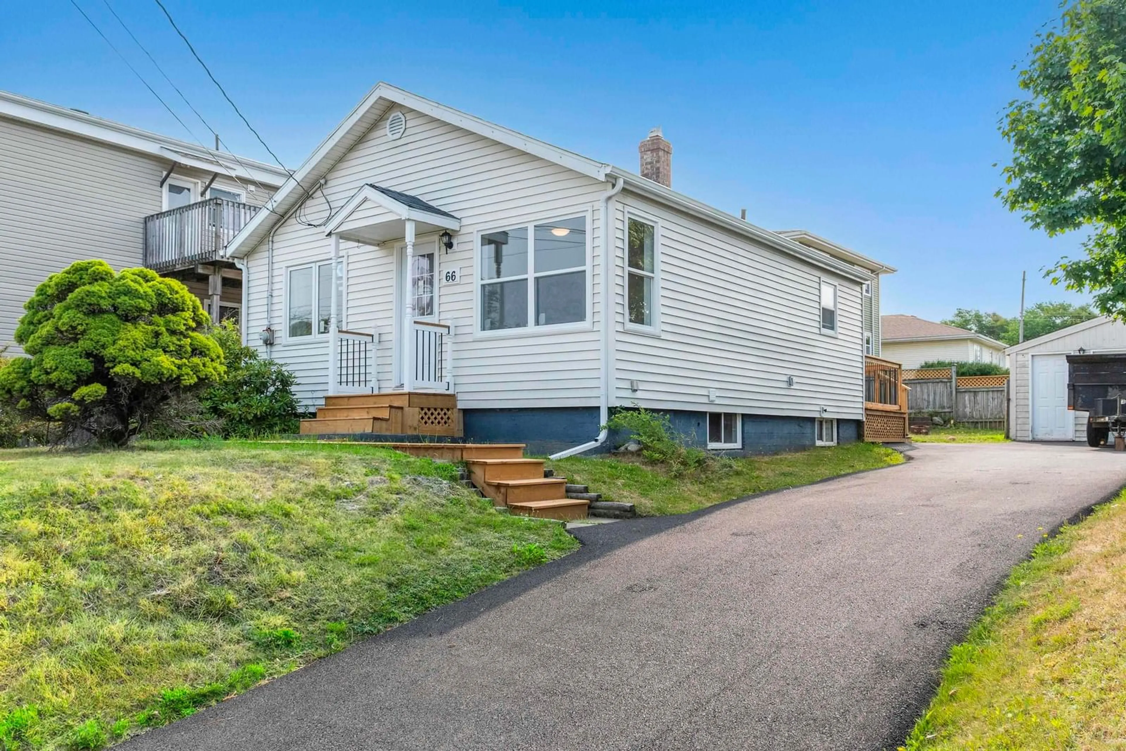 Home with vinyl exterior material, street for 66 Woodland Ave, Dartmouth Nova Scotia B3A 3K1