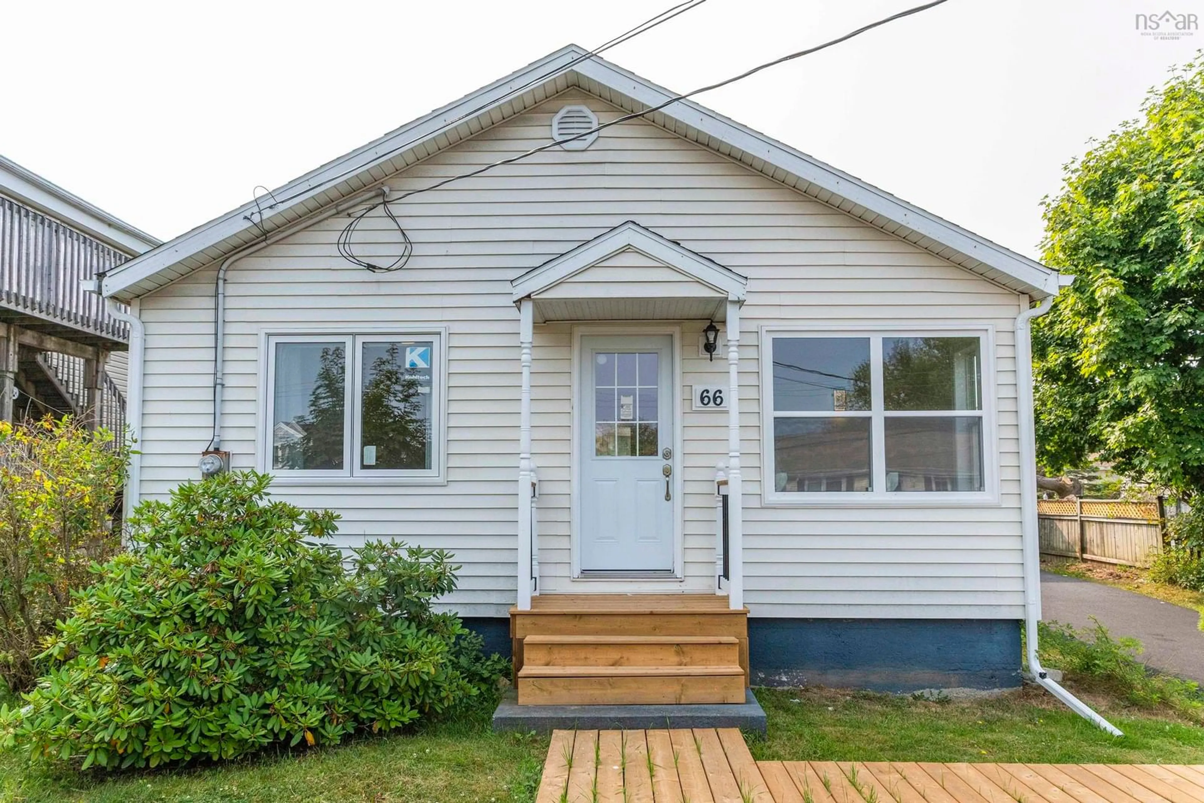 Home with vinyl exterior material, street for 66 Woodland Ave, Dartmouth Nova Scotia B3A 3K1