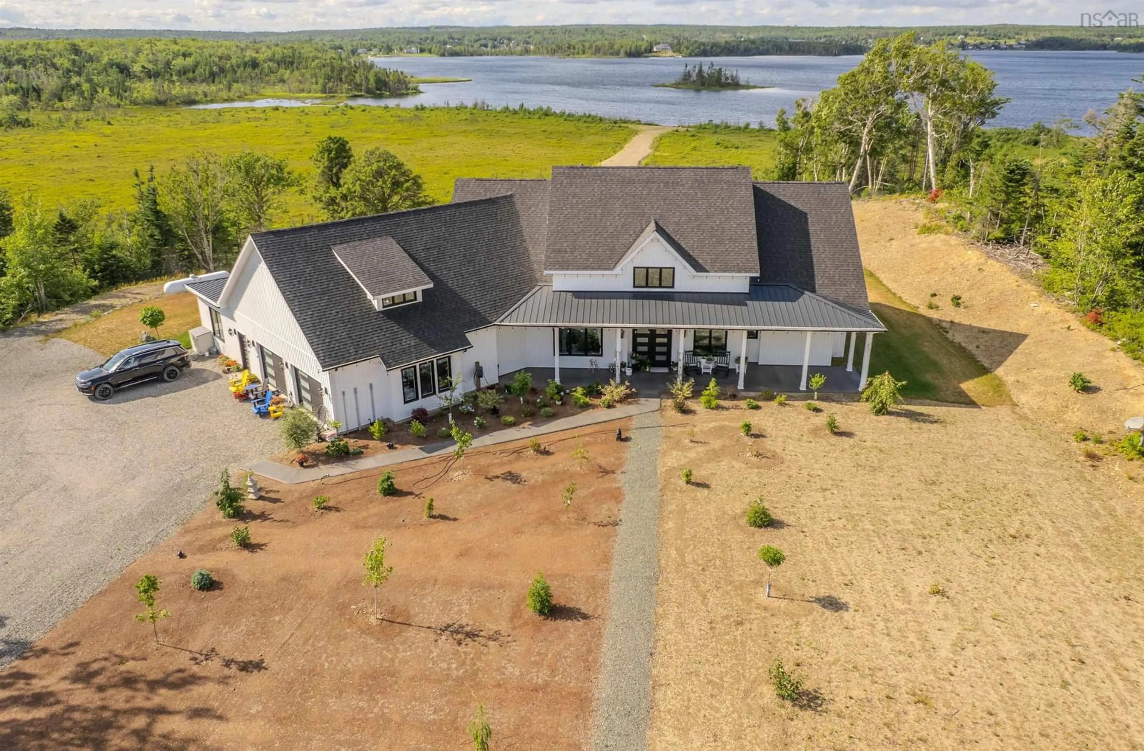 A pic from outside/outdoor area/front of a property/back of a property/a pic from drone, water/lake/river/ocean view for 377 Shieling Dr, Marion Bridge Nova Scotia B1K 0B3