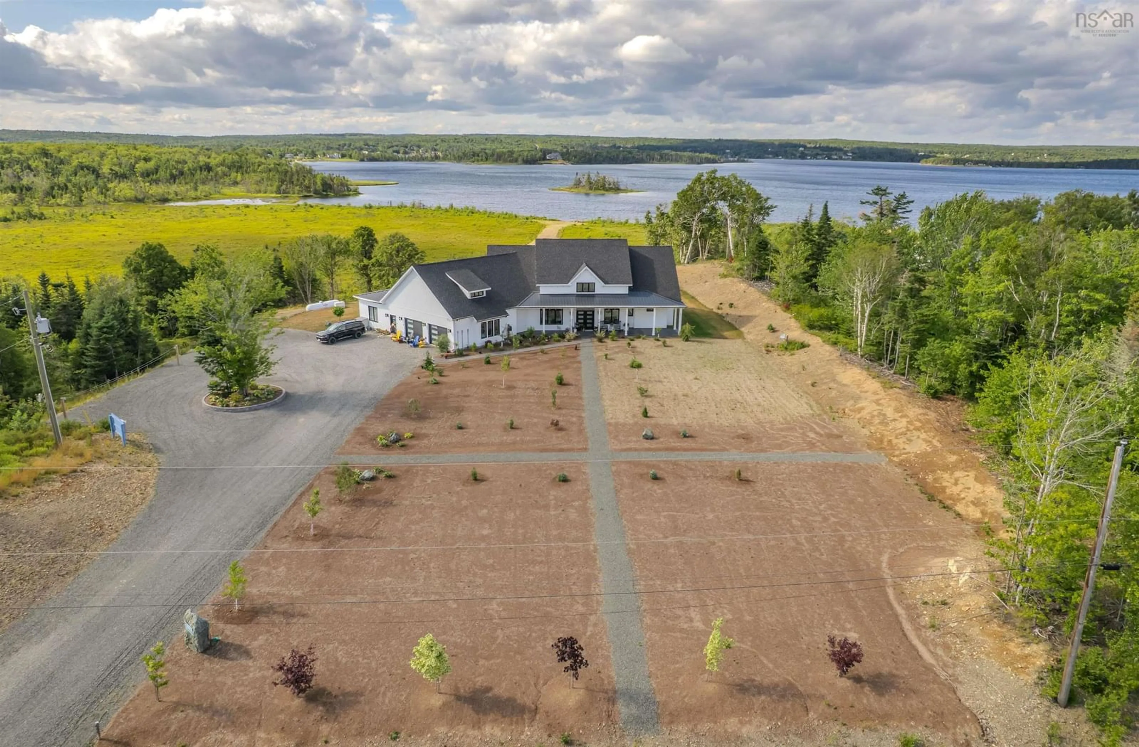 A pic from outside/outdoor area/front of a property/back of a property/a pic from drone, water/lake/river/ocean view for 377 Shieling Dr, Marion Bridge Nova Scotia B1K 0B3