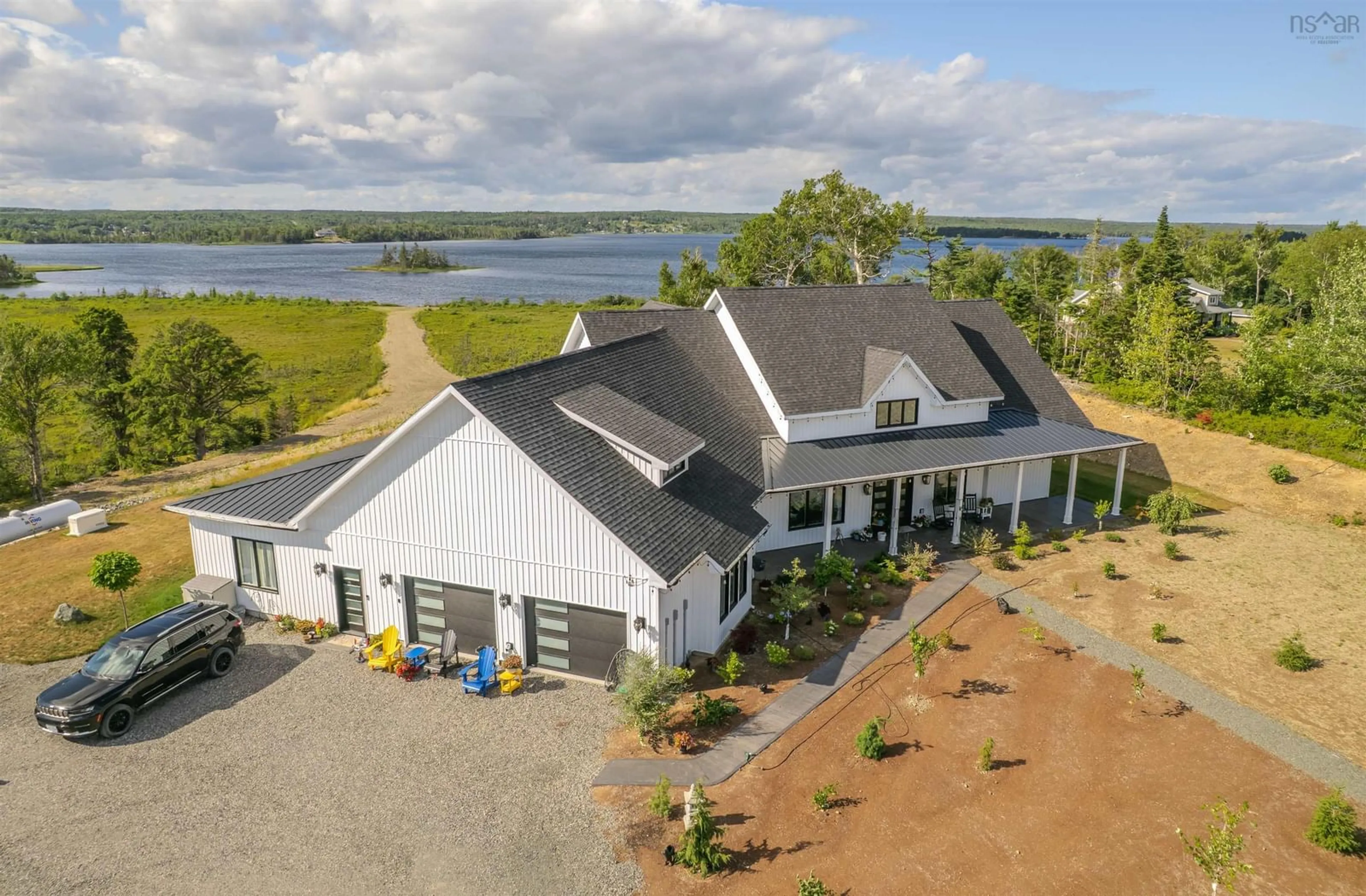 A pic from outside/outdoor area/front of a property/back of a property/a pic from drone, water/lake/river/ocean view for 377 Shieling Dr, Marion Bridge Nova Scotia B1K 0B3