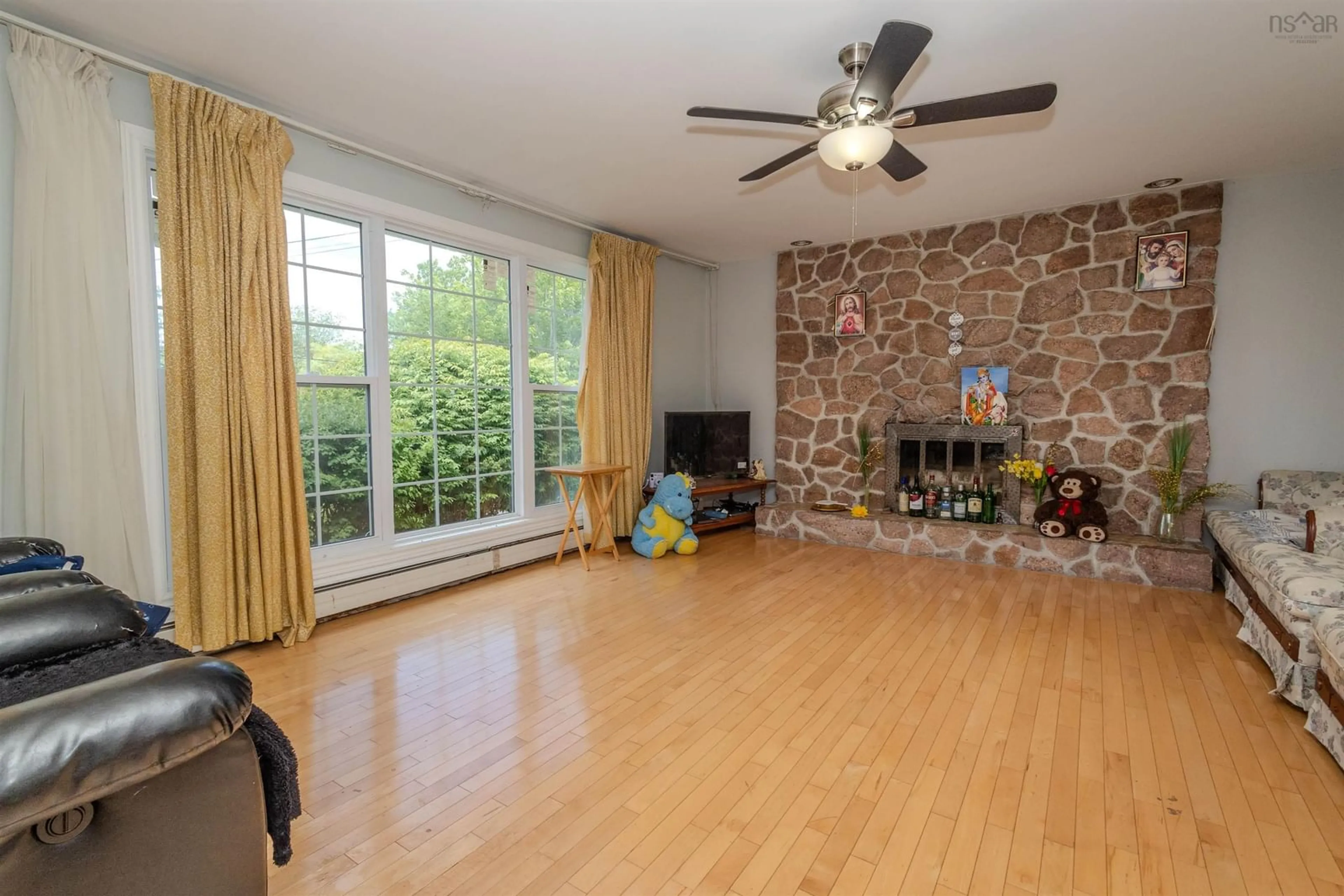 Living room with furniture, wood/laminate floor for 14 Tower Hts, Sydney Nova Scotia B1P 2C4