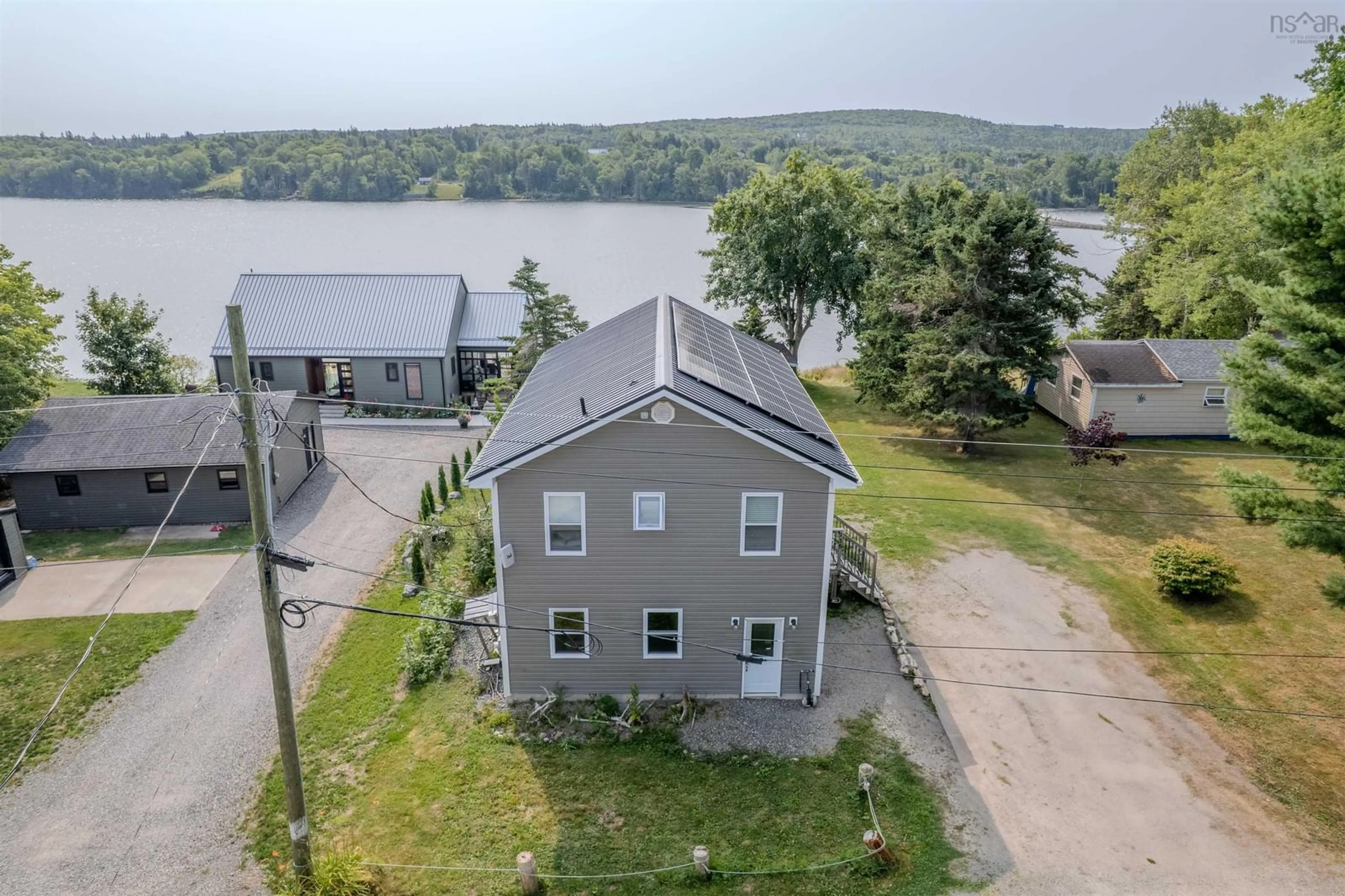 A pic from outside/outdoor area/front of a property/back of a property/a pic from drone, water/lake/river/ocean view for 115 Morrison Rd, North Side East Bay Nova Scotia B1J 1B9