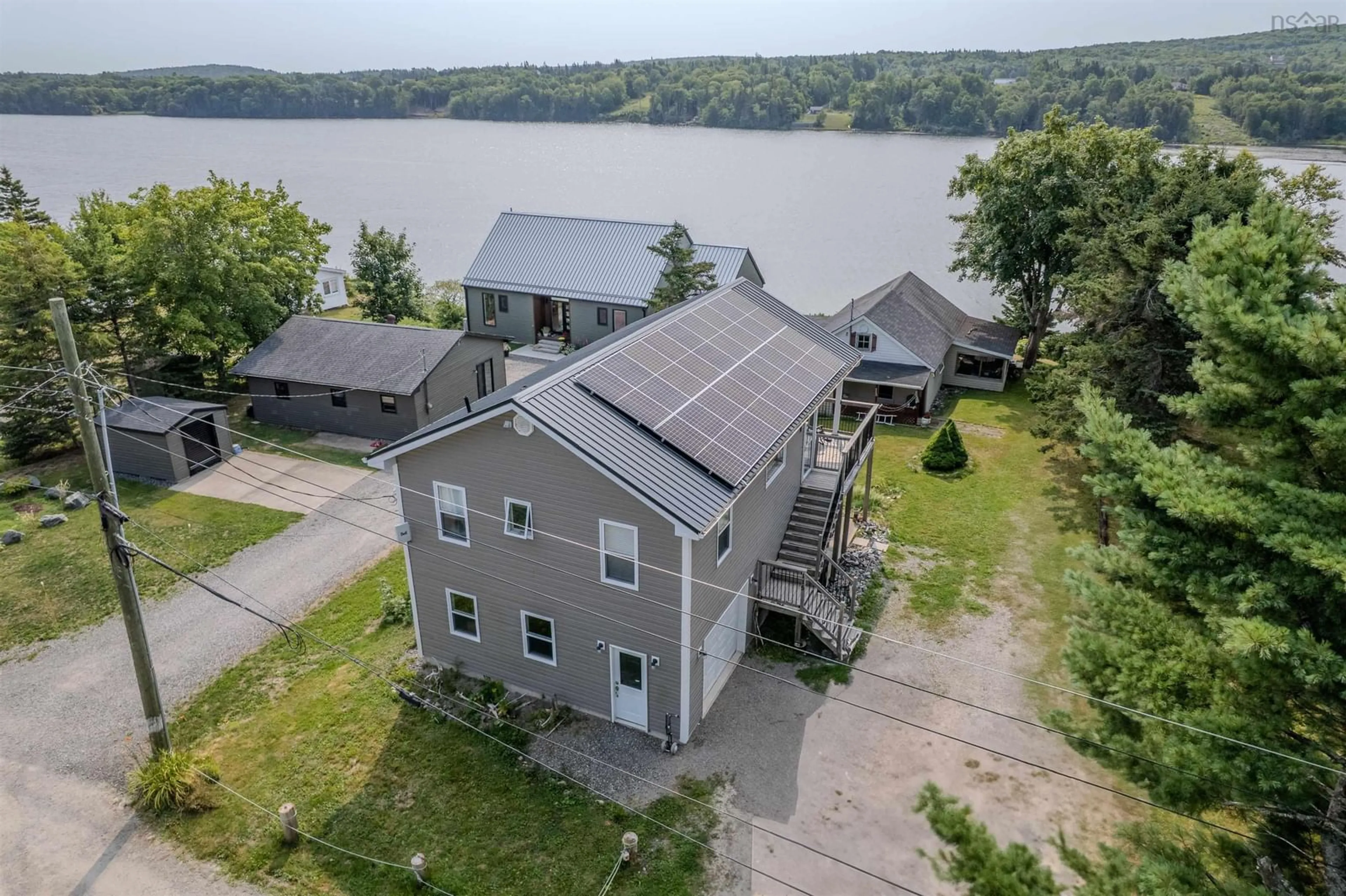 A pic from outside/outdoor area/front of a property/back of a property/a pic from drone, water/lake/river/ocean view for 115 Morrison Rd, North Side East Bay Nova Scotia B1J 1B9