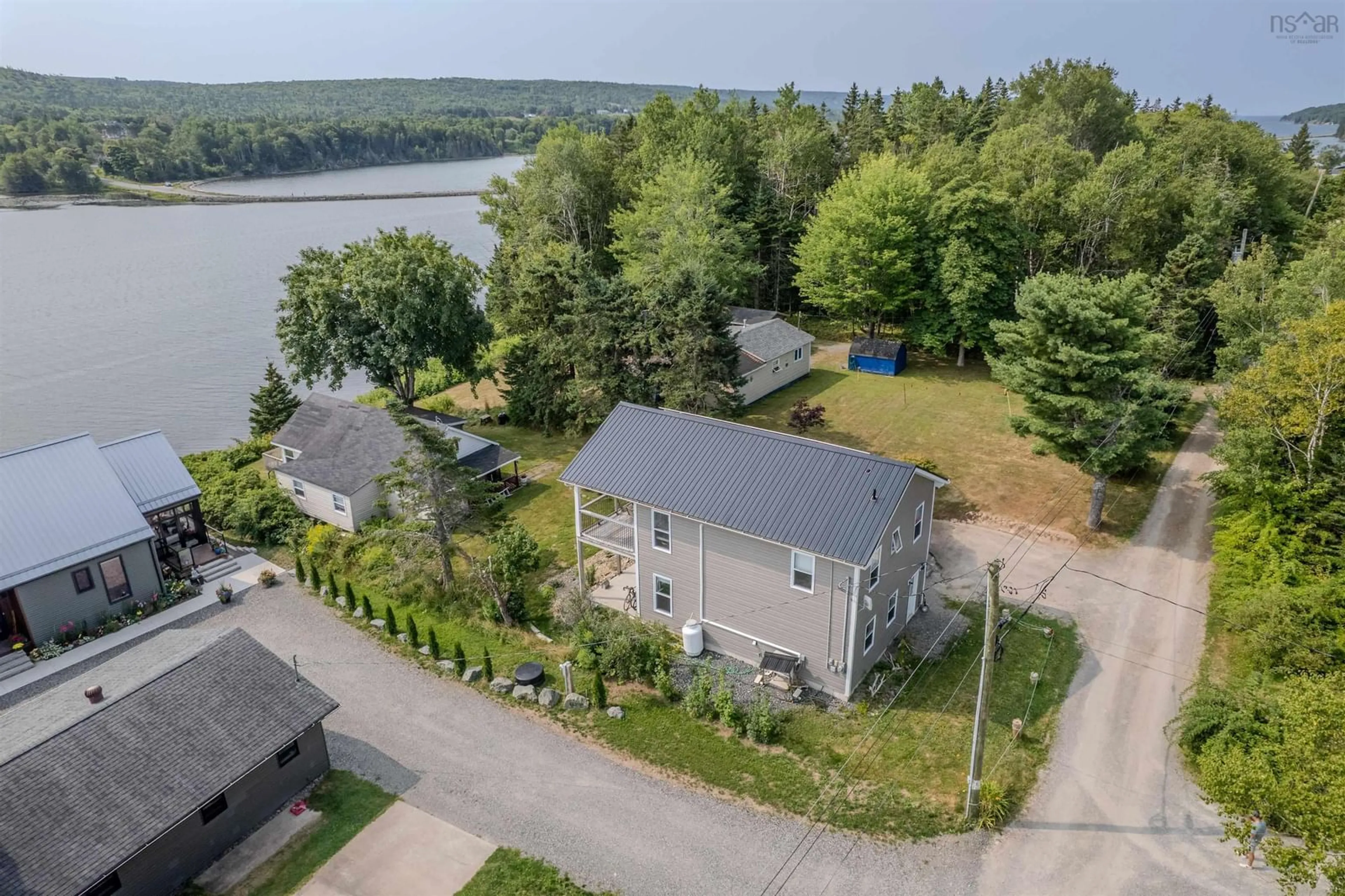 A pic from outside/outdoor area/front of a property/back of a property/a pic from drone, water/lake/river/ocean view for 115 Morrison Rd, North Side East Bay Nova Scotia B1J 1B9
