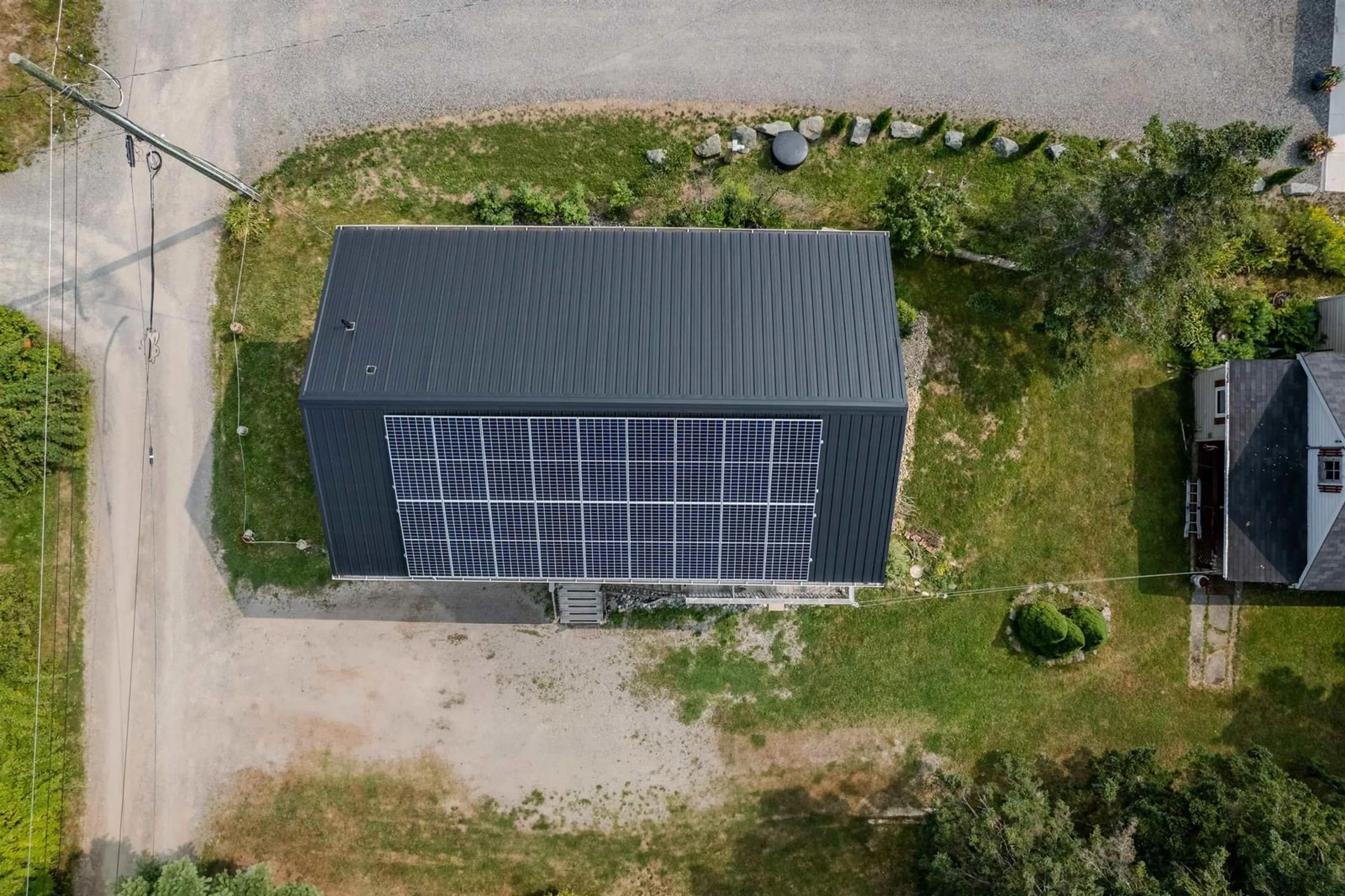 A pic from outside/outdoor area/front of a property/back of a property/a pic from drone, building for 115 Morrison Rd, North Side East Bay Nova Scotia B1J 1B9