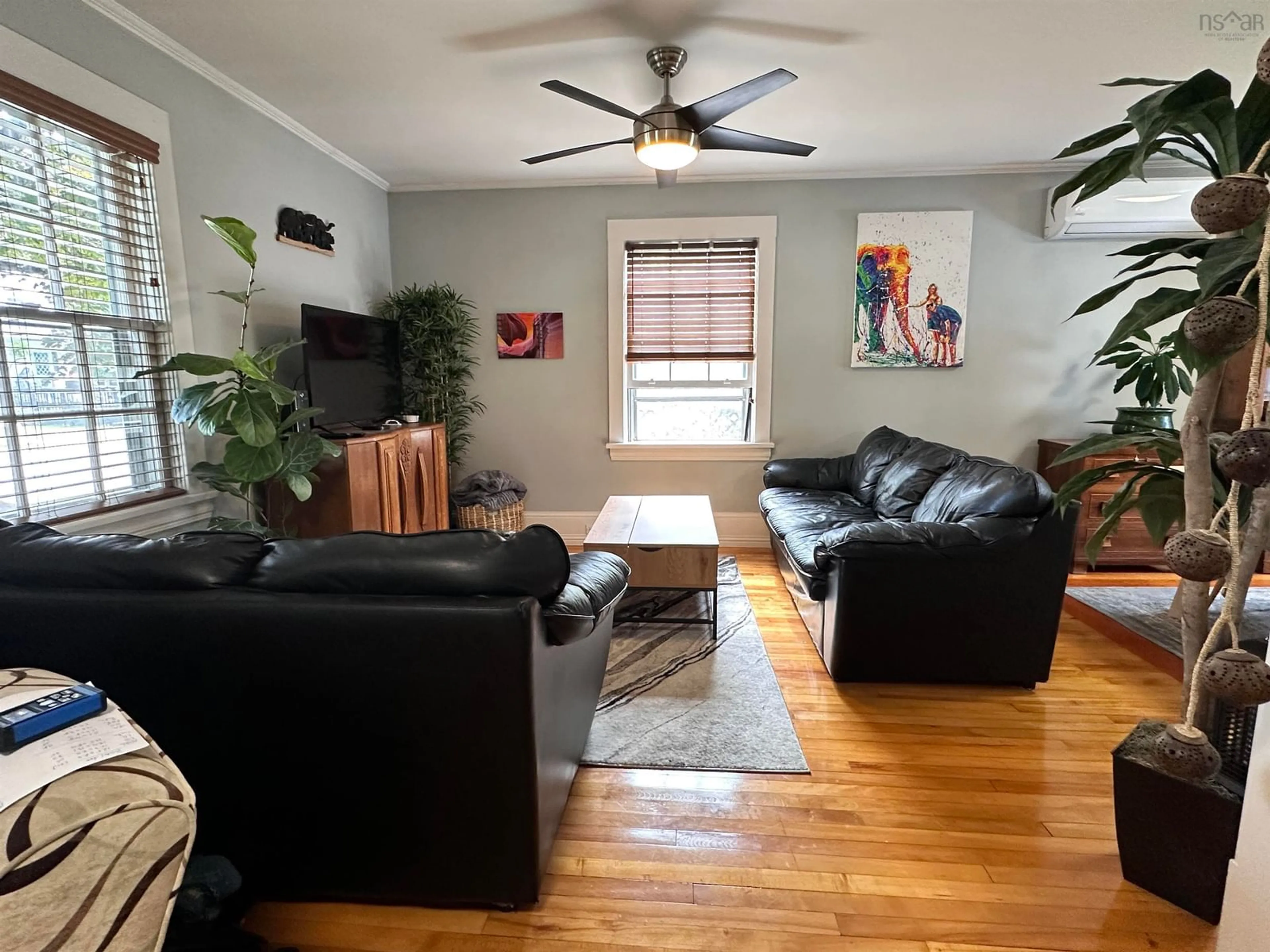 Living room with furniture, wood/laminate floor for 103 Bristol Ave, Liverpool Nova Scotia B0T 1K0