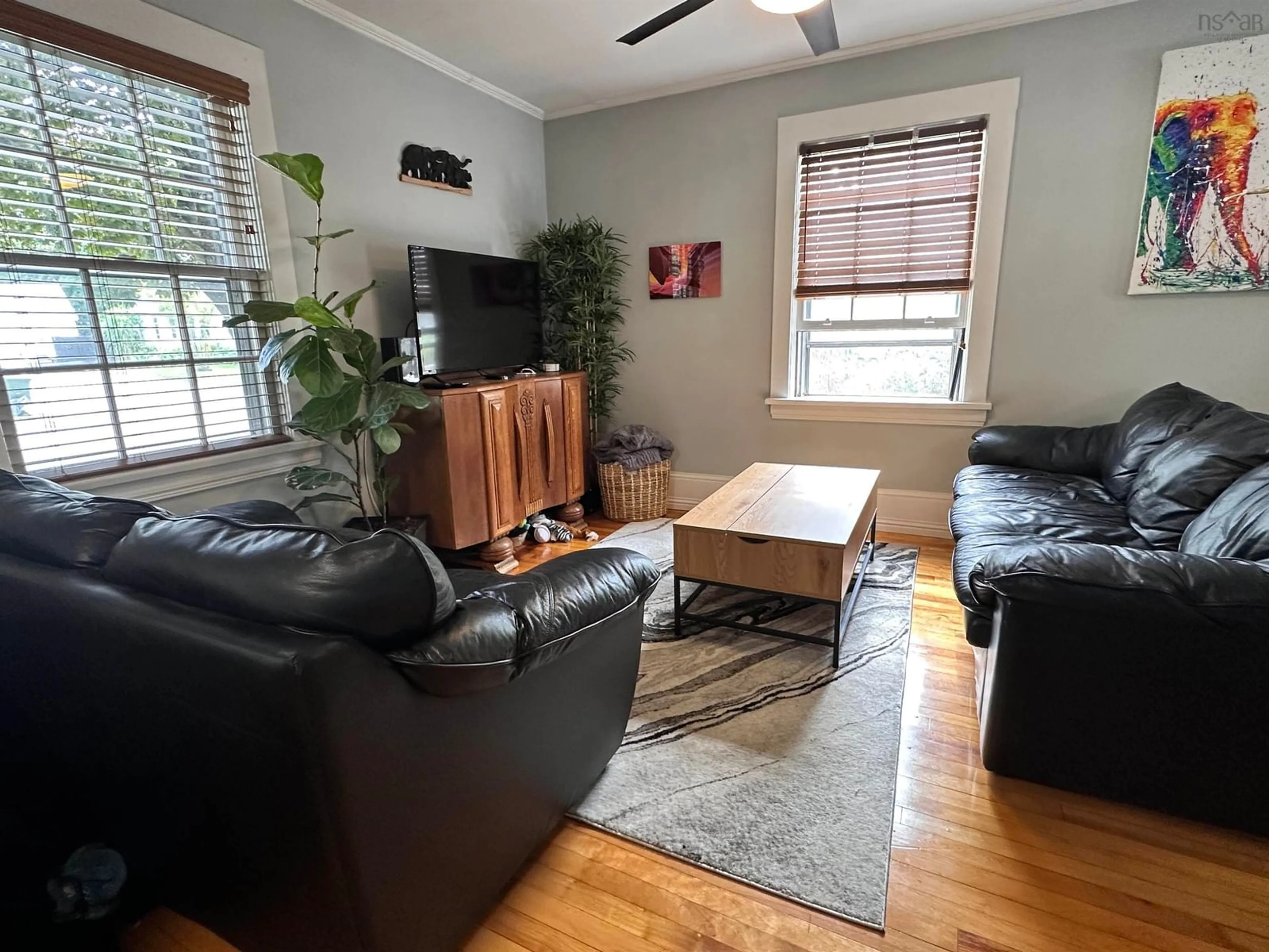 Living room with furniture, wood/laminate floor for 103 Bristol Ave, Liverpool Nova Scotia B0T 1K0