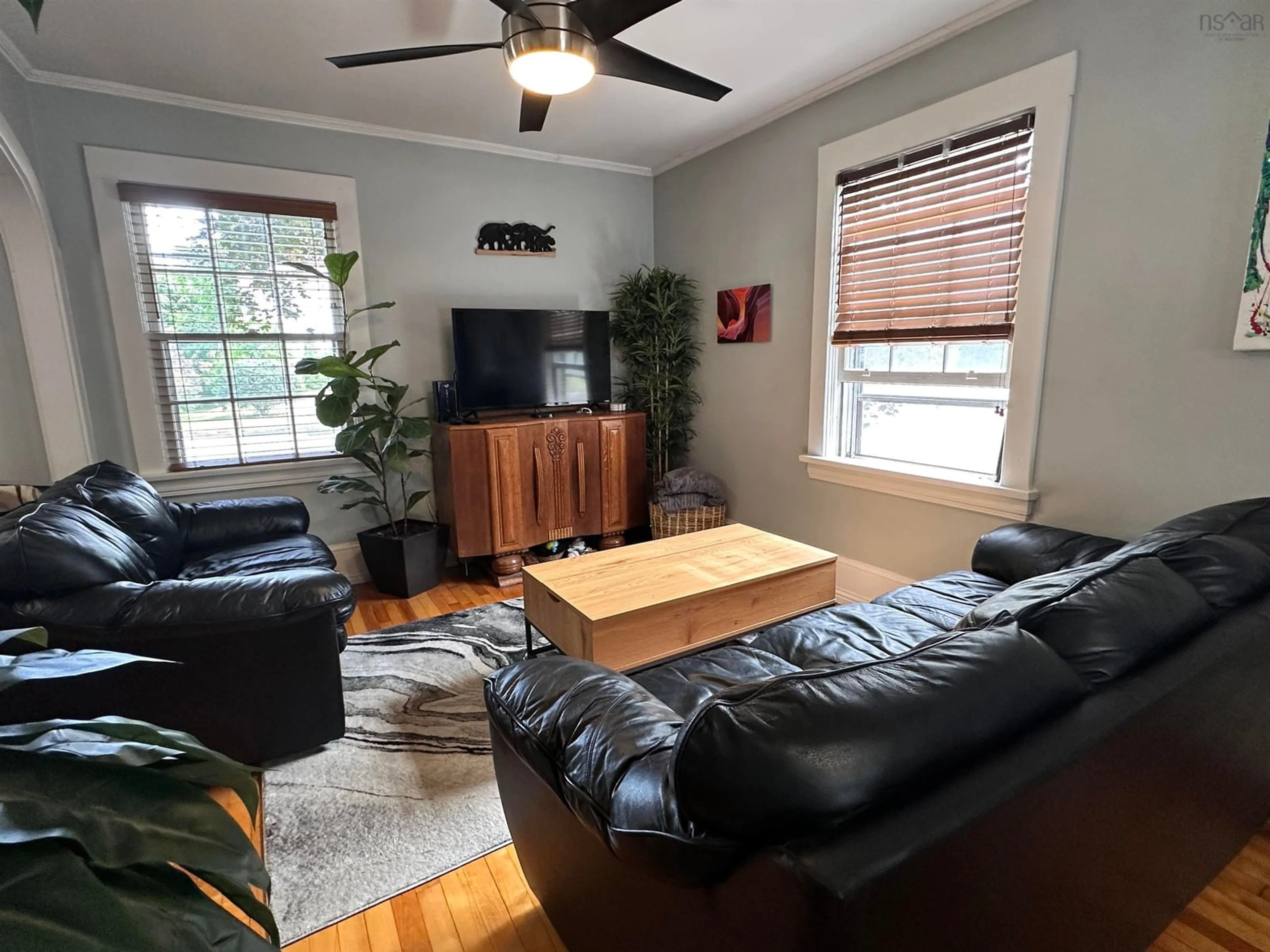 Living room with furniture, wood/laminate floor for 103 Bristol Ave, Liverpool Nova Scotia B0T 1K0