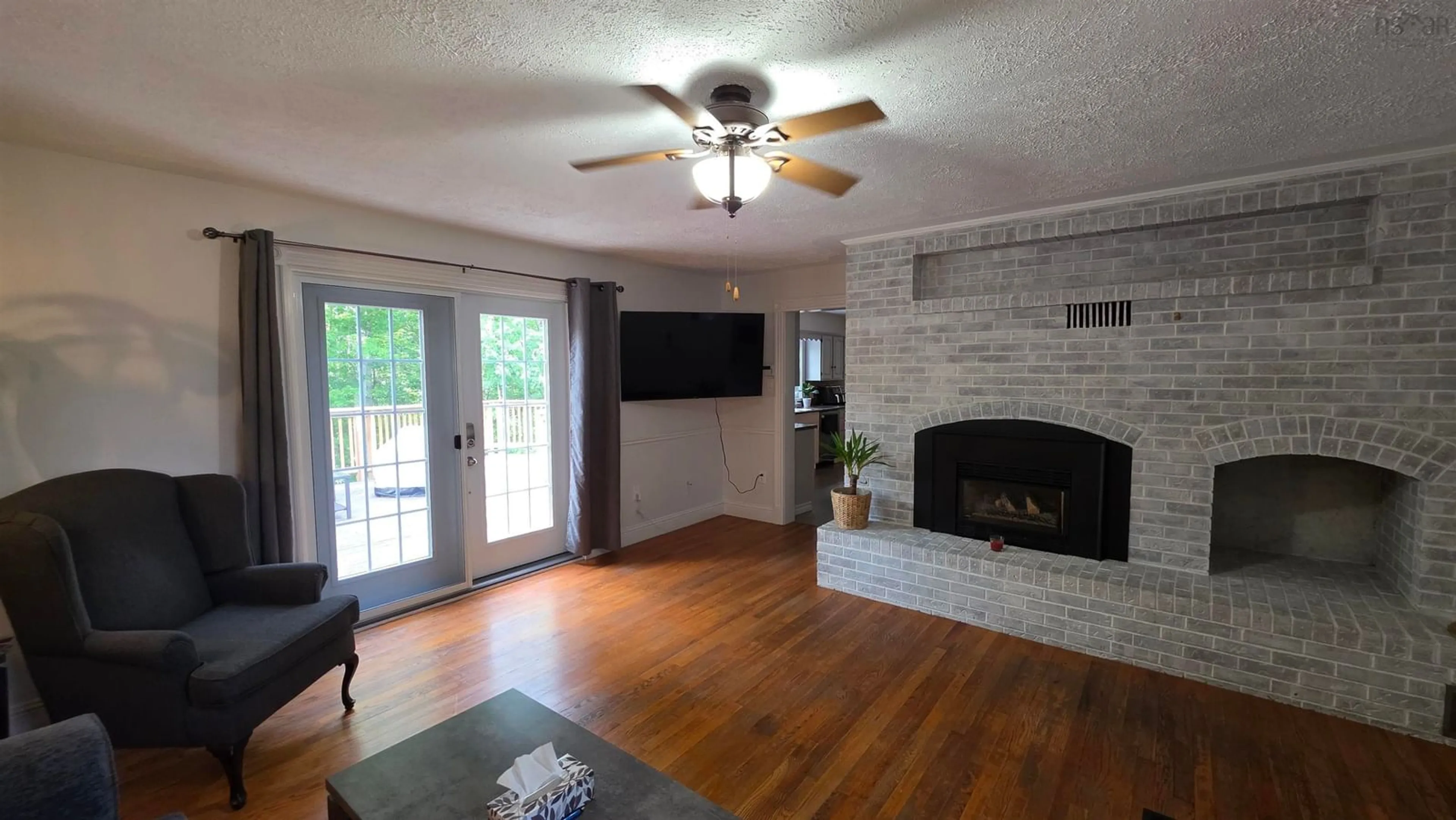 Living room with furniture, wood/laminate floor for 56 Woodvale Pl, New Minas Nova Scotia B4N 4L7