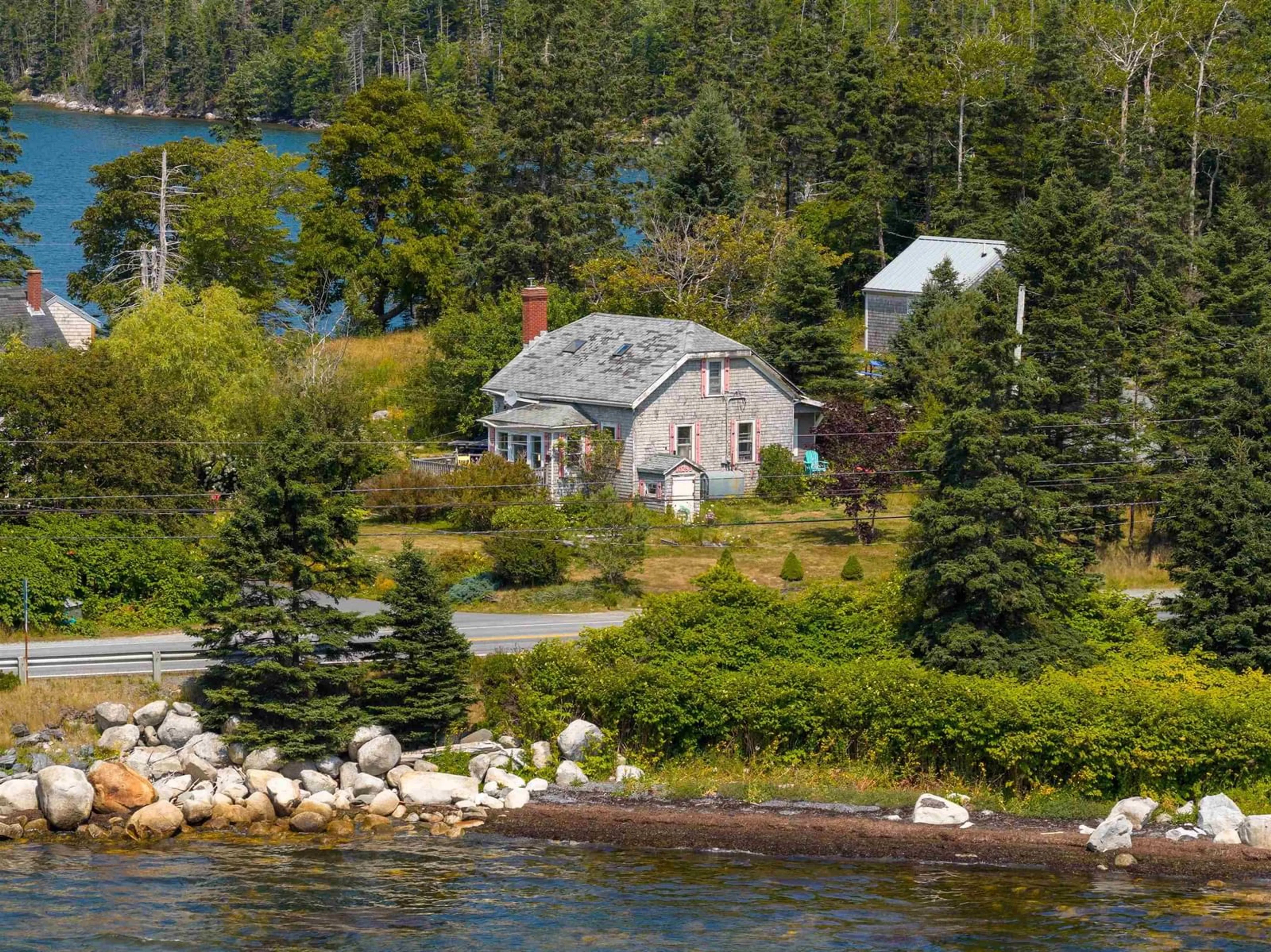 A pic from outside/outdoor area/front of a property/back of a property/a pic from drone, water/lake/river/ocean view for 10293 Highway Hwy, Oyster Pond Nova Scotia B0J 1P0